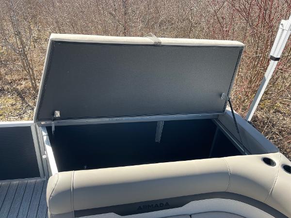 2025 Armada Saphir 23CR boat storage compartment open, showcasing spacious interior.