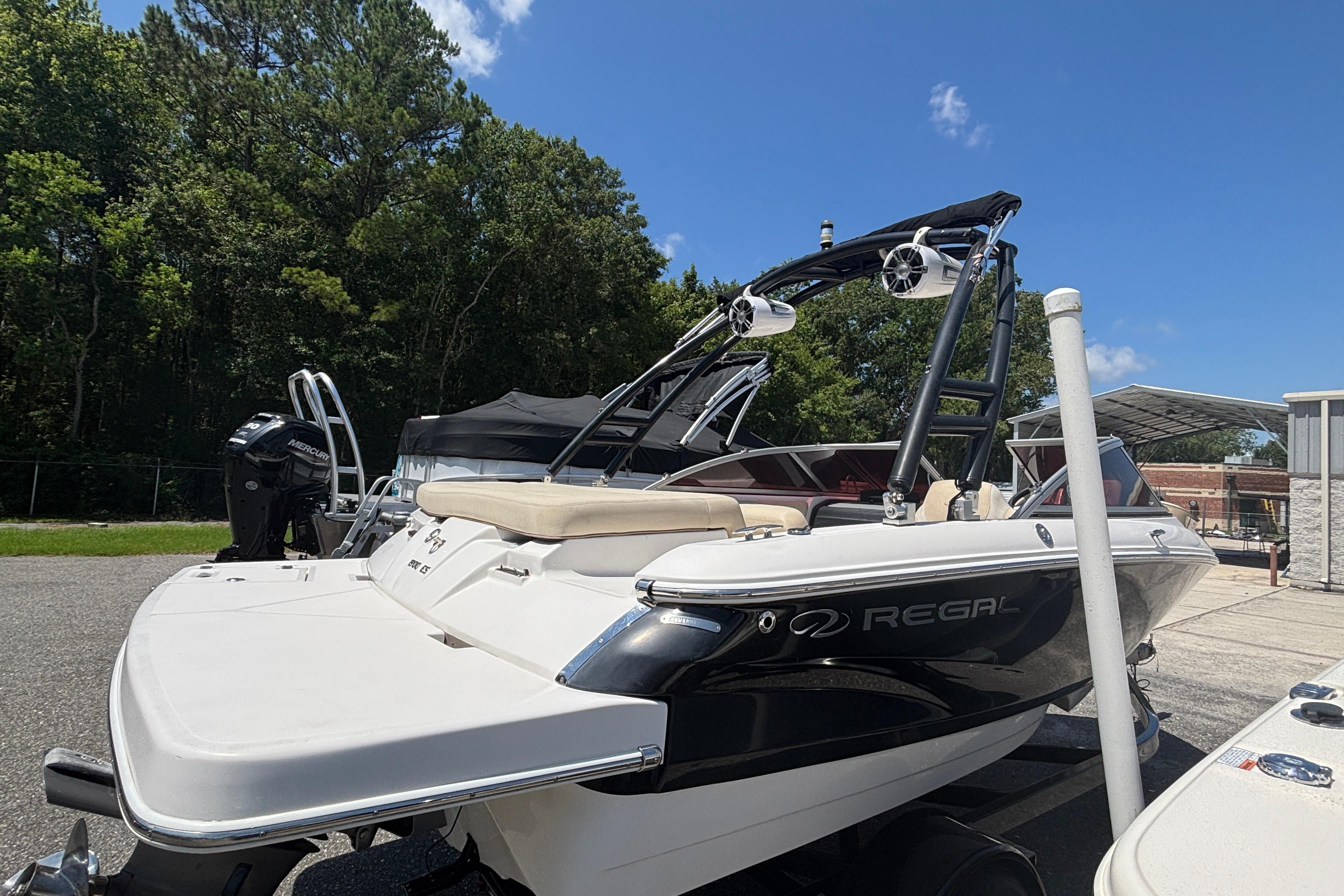2018 Regal 1900 ES Bowrider boat parked outdoors on a sunny day.