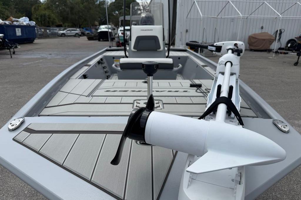 2026 Tracker Bass Tracker Classic CC boat with trolling motor, parked outdoors.