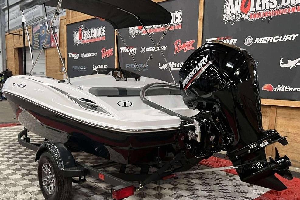 2026 Tahoe T16 boat with Mercury engine on display indoors.