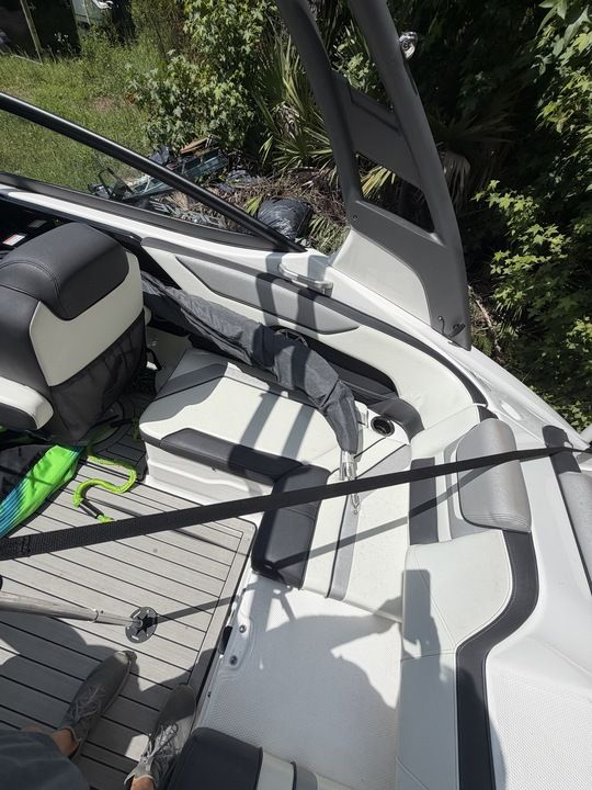 The image shows the interior of a 2022 Yamaha 212SD boat with seating and upholstery.