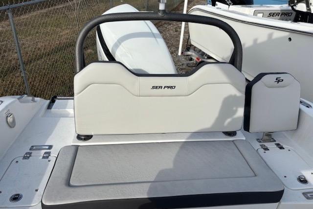 2025 Sea Pro 225FLX Sandbar boat interior with seating and storage.