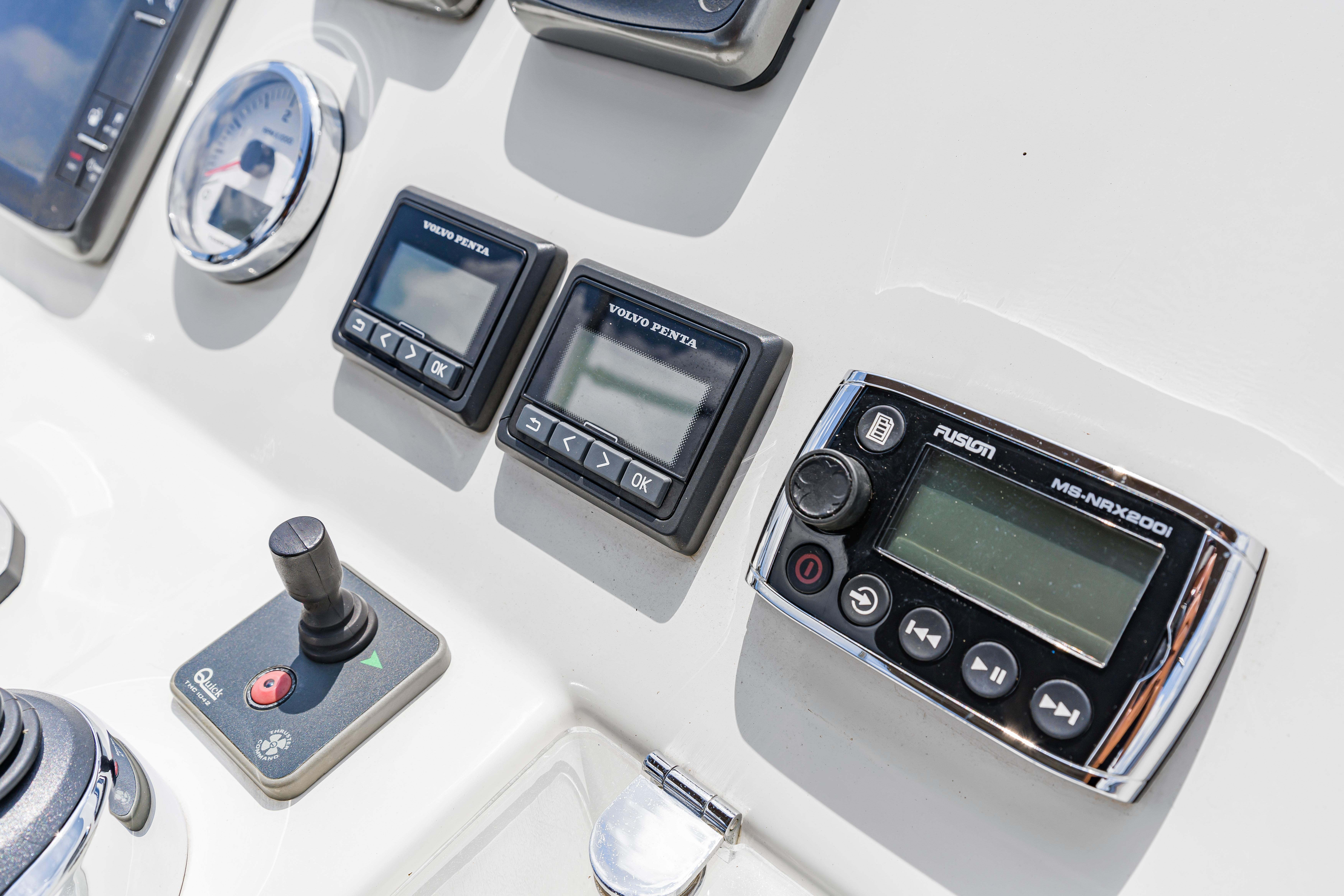 Control panel of a 2017 Prestige 500 yacht with various electronic displays.