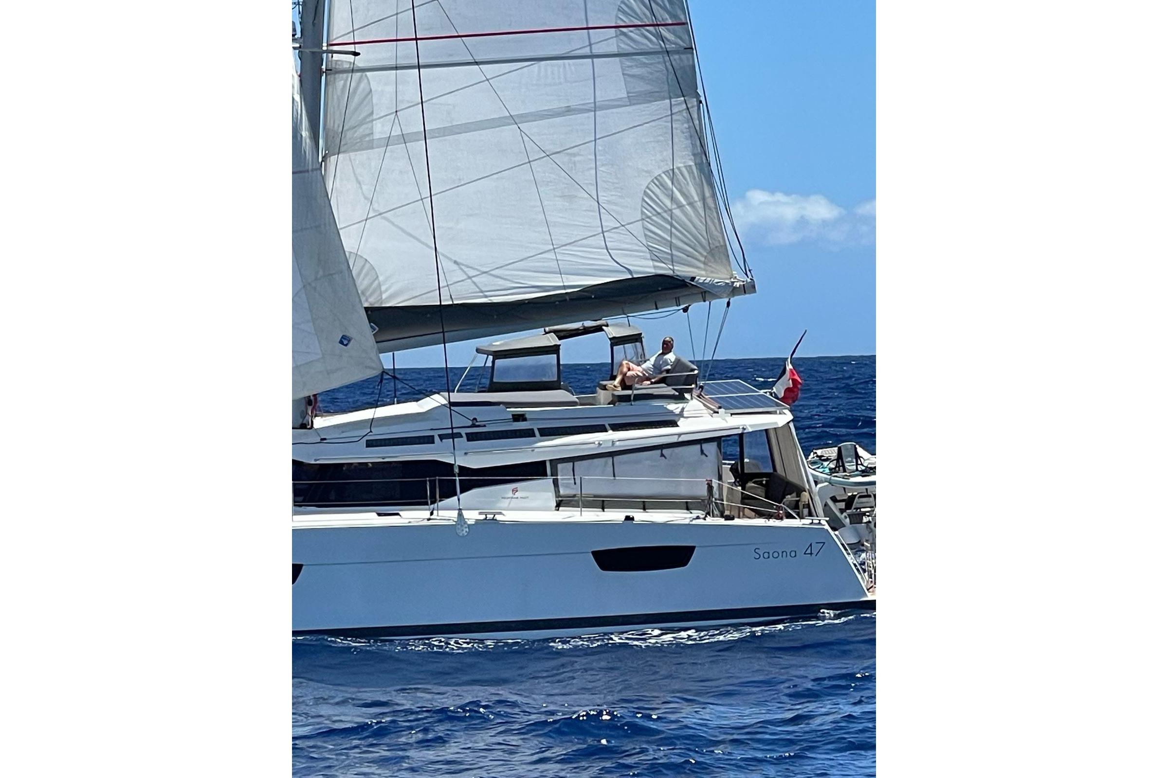 2020 Fountaine Pajot Saona 47 sailing on open sea with full sails.
