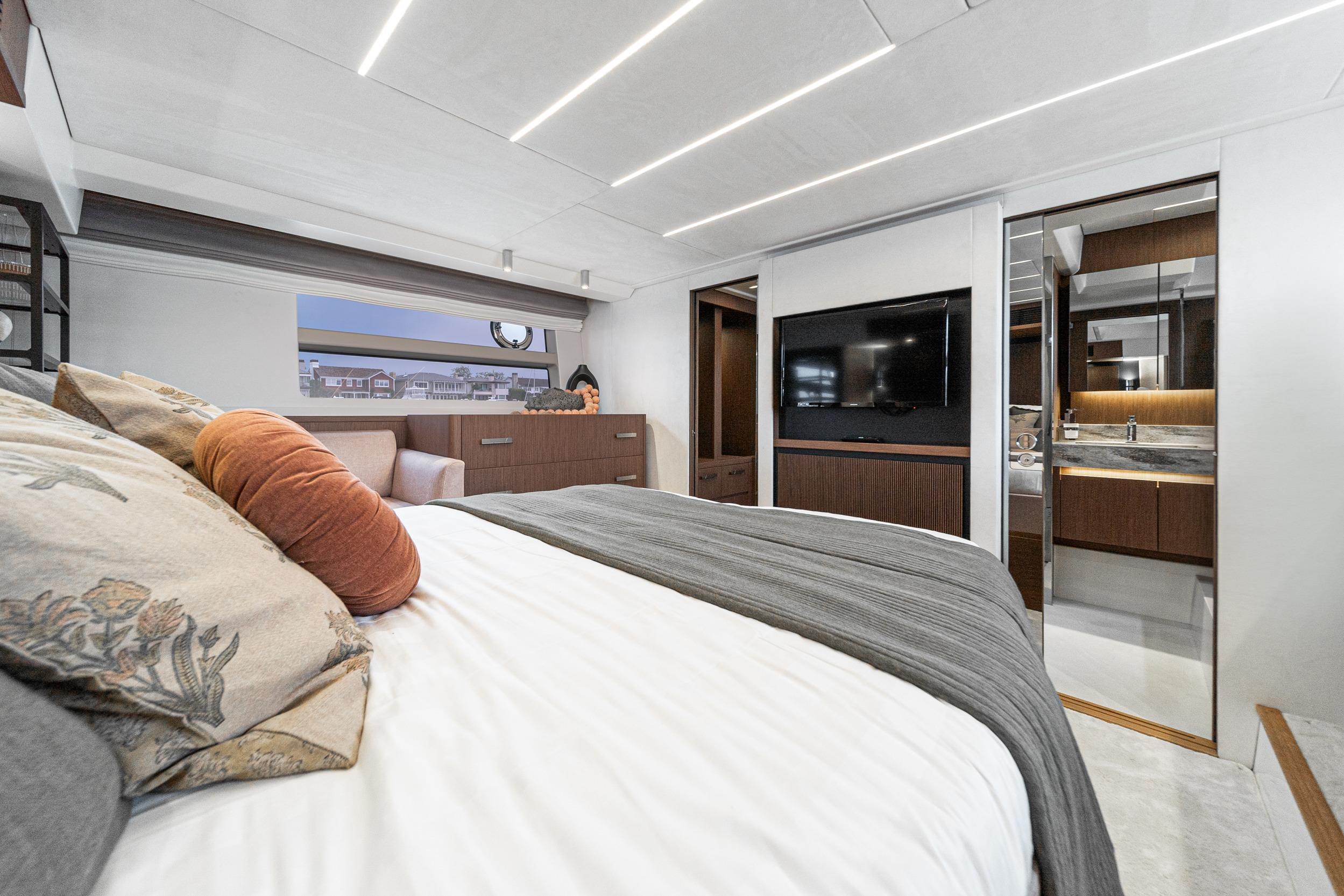 Luxurious bedroom interior of 2024 Prestige X60 yacht with modern design and elegant furnishings.