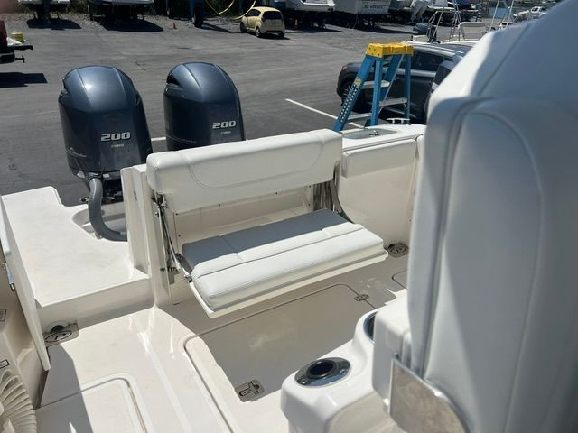 The image shows the stern of a Pursuit S268 boat with two outboard engines.