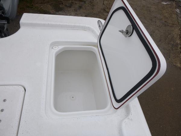 Open storage compartment on 2025 Sea Pro 250 Bay boat.