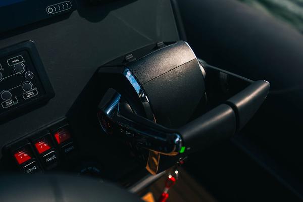 Close-up of 2024 Onda Magna boat throttle control and dashboard.