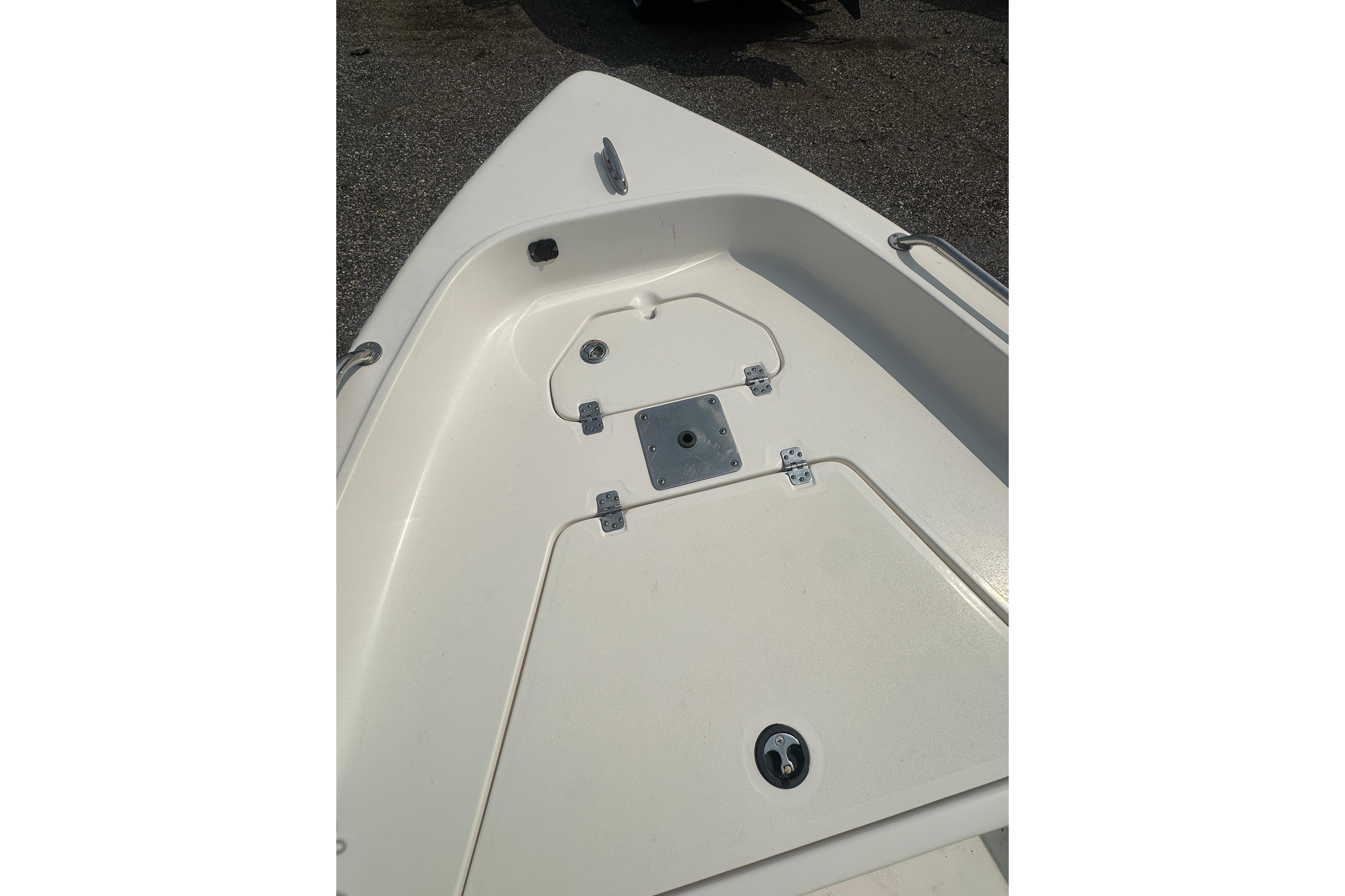 2018 Key West 1720 Center Console boat deck, featuring storage compartments and clean design.