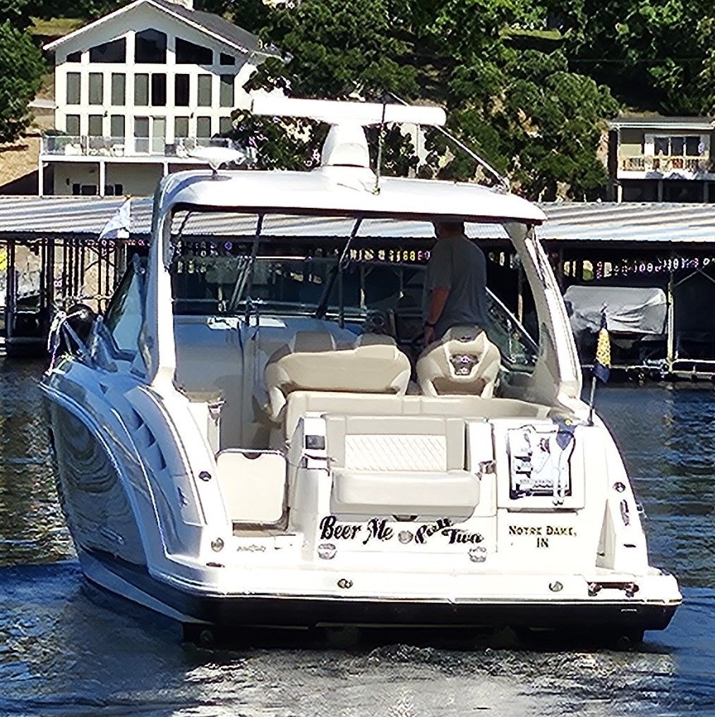 2014 Chaparral 330 Signature yacht on a serene lake.