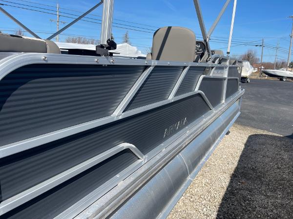 2025 Armada Saphir 23CR pontoon boat, sleek design, parked outdoors on gravel.