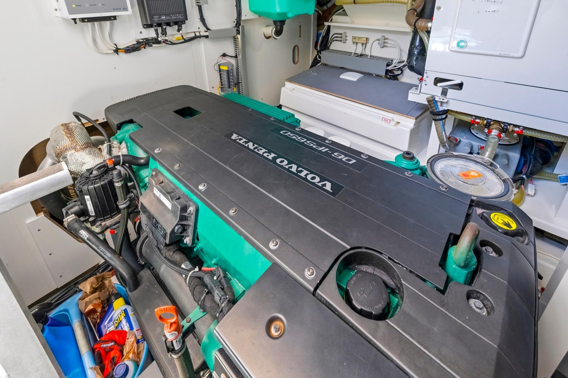 Engine room of a 2022 Prestige 520 yacht featuring a Volvo Penta engine.
