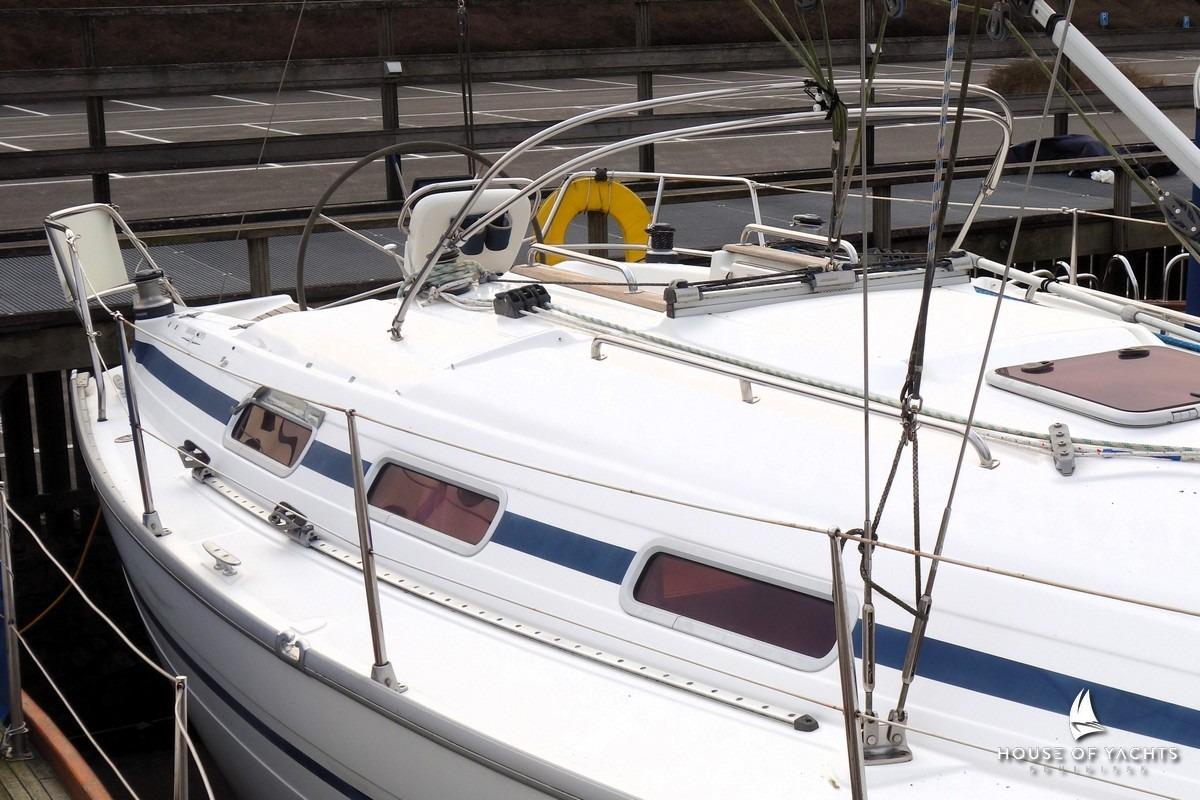 2003 Bavaria 32 sailboat docked, featuring sleek design and spacious deck.