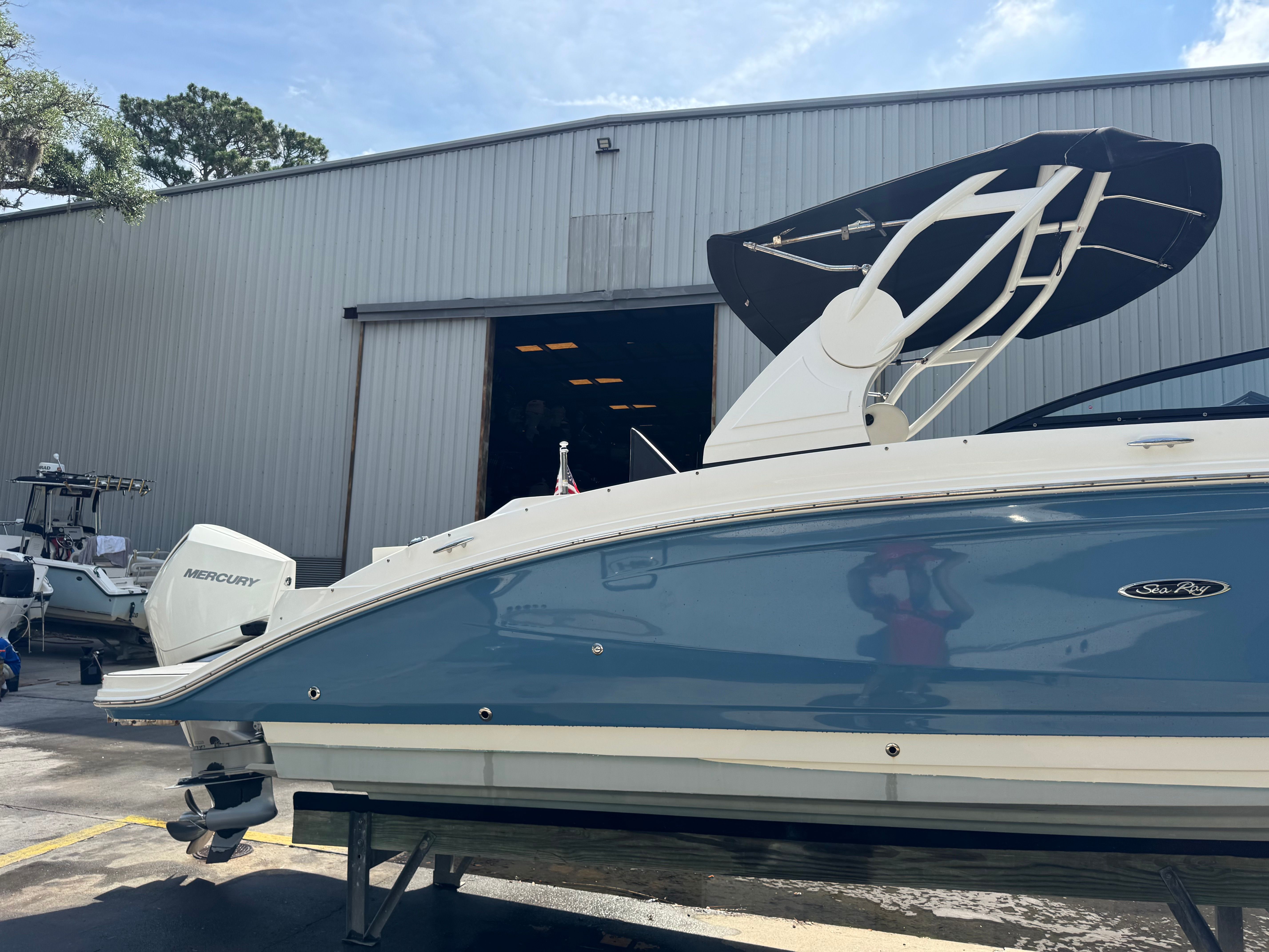 2020 Sea Ray SDX 270 Outboard in front of warehouse.