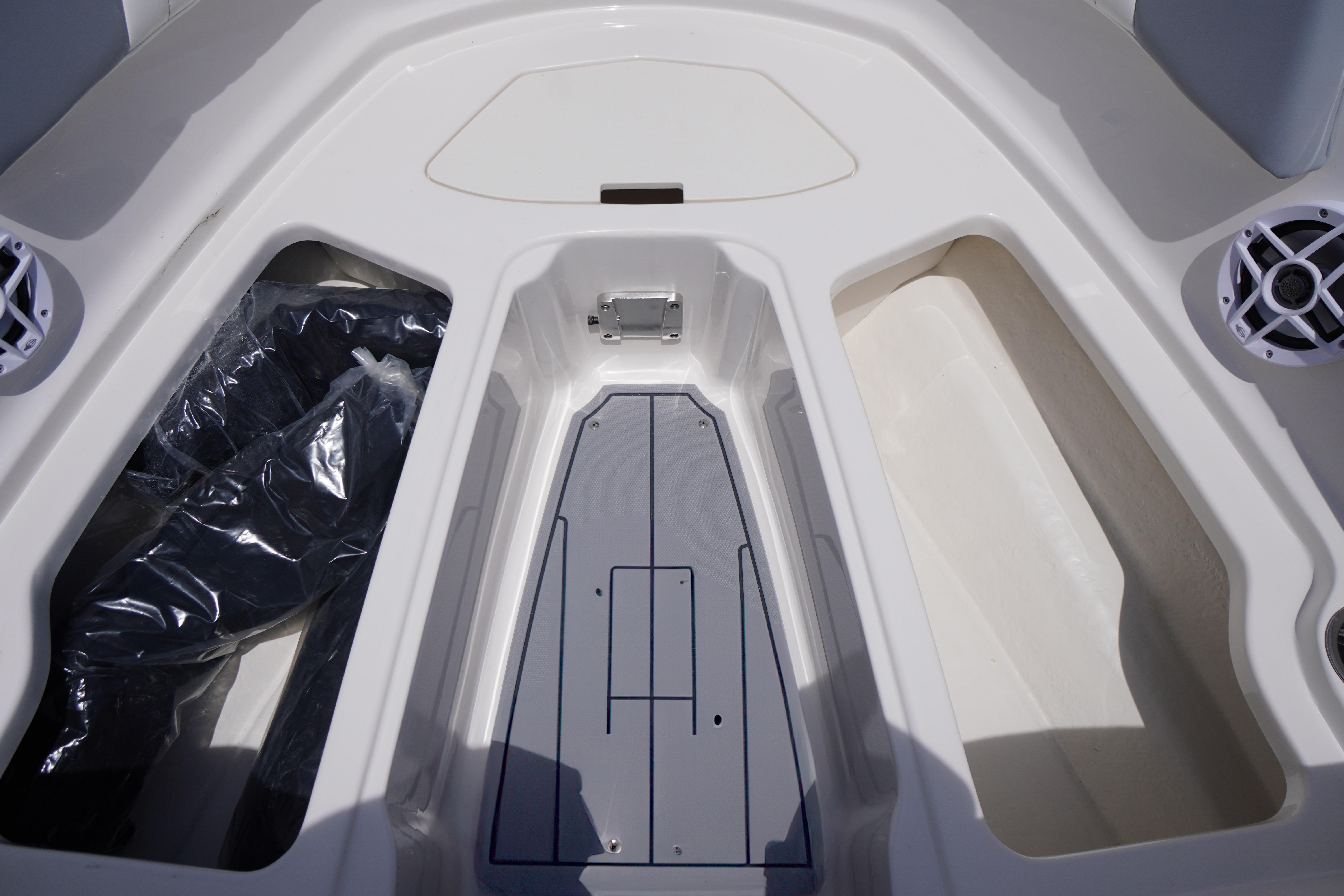 2026 Chaparral 23 SSi OB boat interior storage compartments and speaker system.