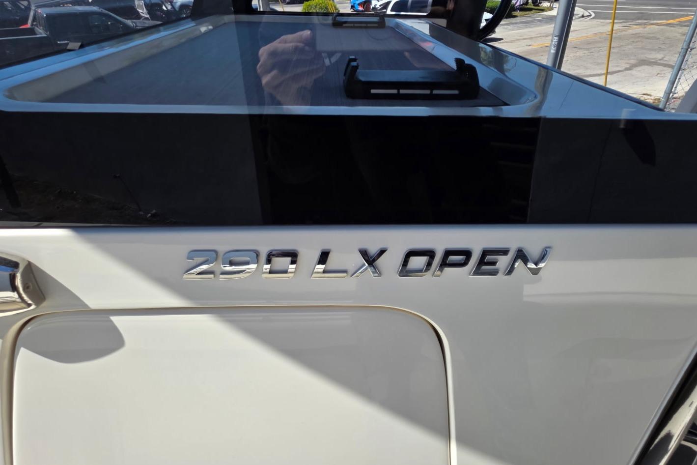 2024 Blackwood 290 LX Open boat, sleek design with chrome lettering.