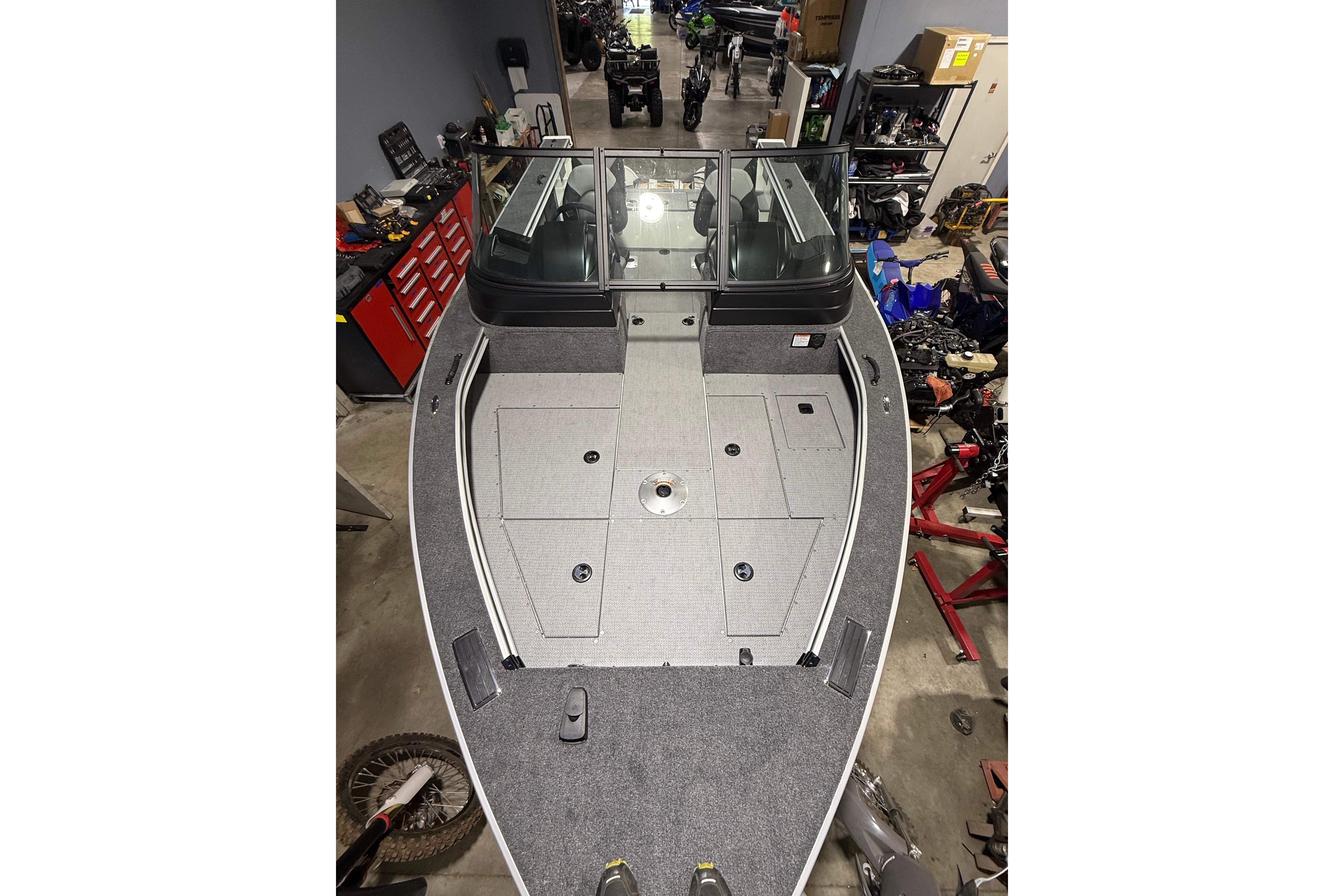 2025 G3 Angler V1850 SF boat interior in a workshop setting.