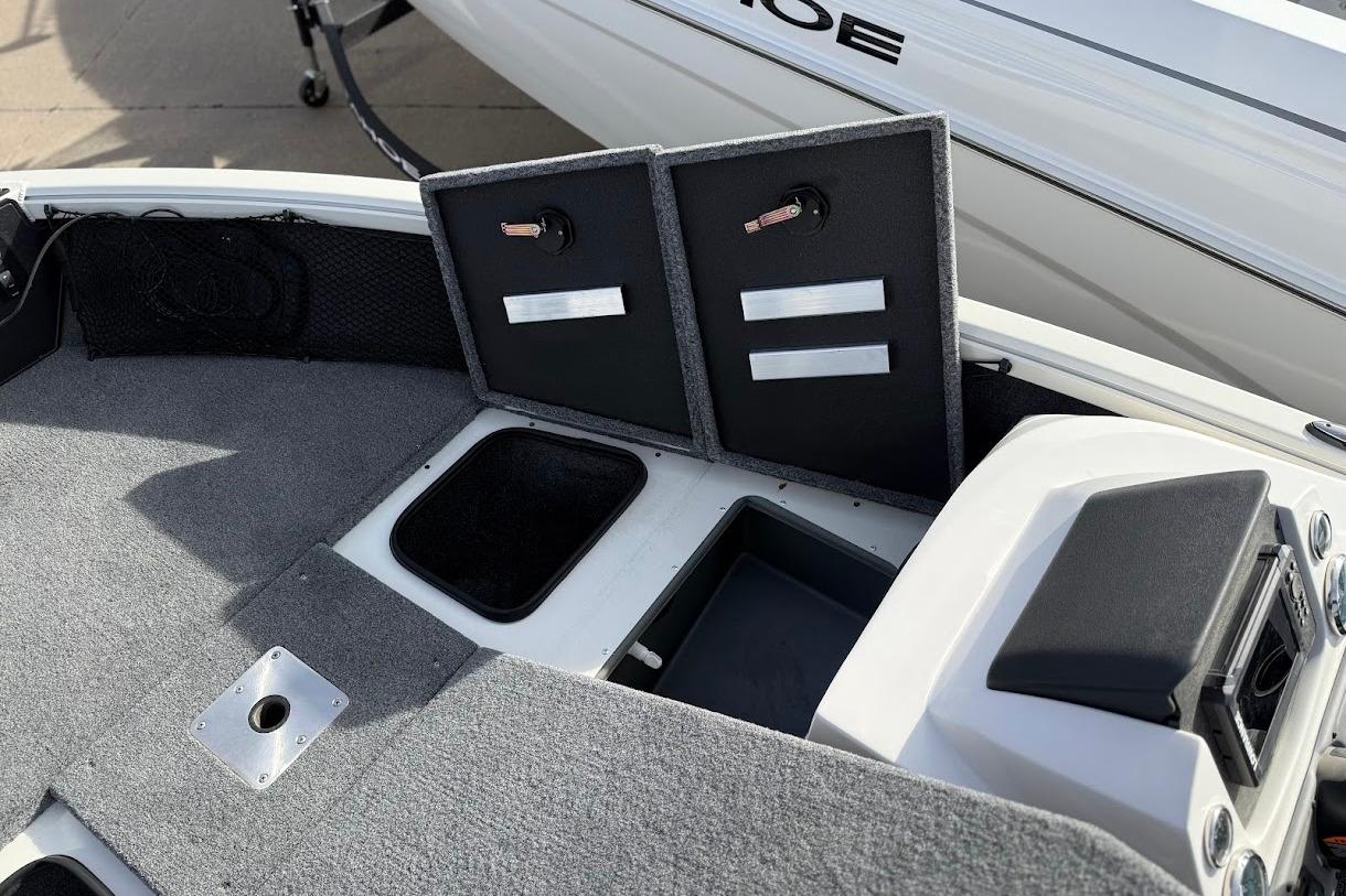 2026 Ranger VS1882SC Reata boat interior with storage compartments and carpeted deck.