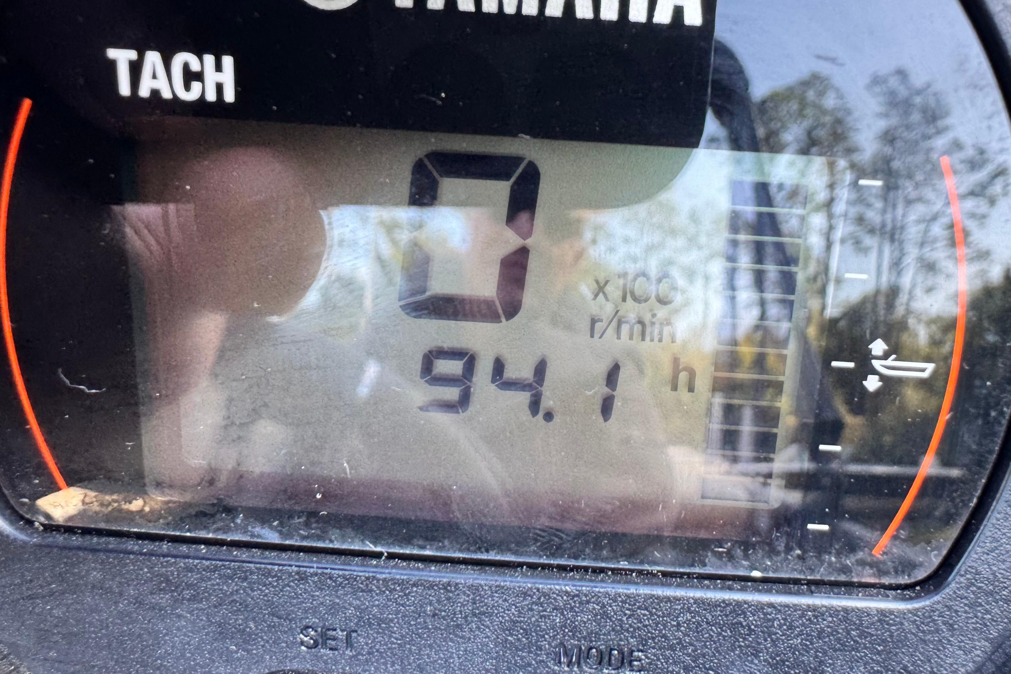 Close-up of a Yamaha tachometer displaying 94.1 hours on a 2023 Sylvan L5 CLZ.
