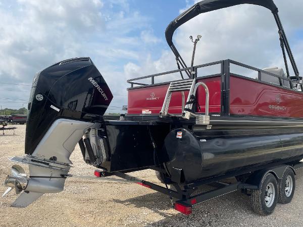 2023 Regency 250DL3 pontoon boat with Mercury outboard motor, on a trailer.
