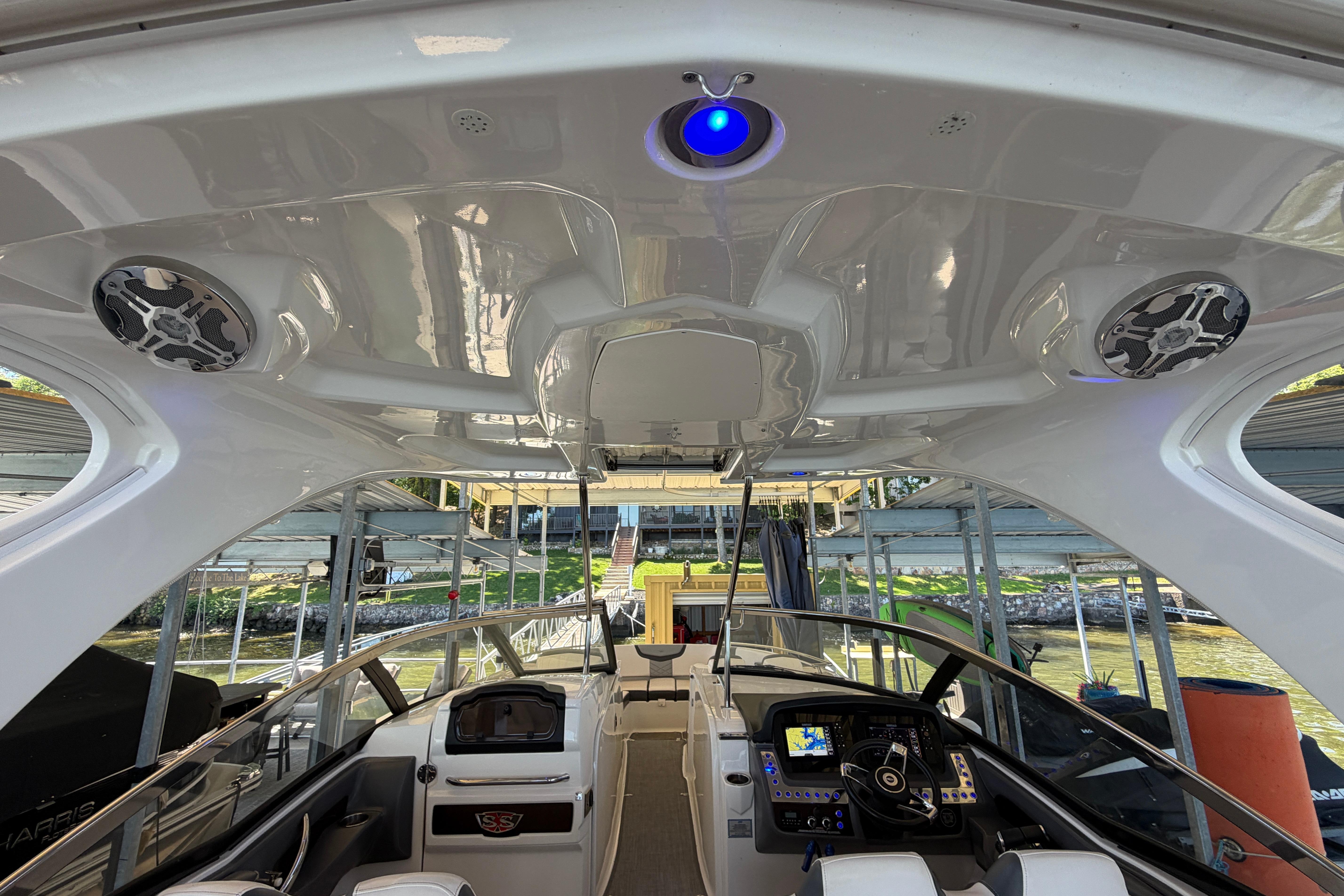 Interior view of 2018 Chaparral 347 SSX boat with modern dashboard and speakers.