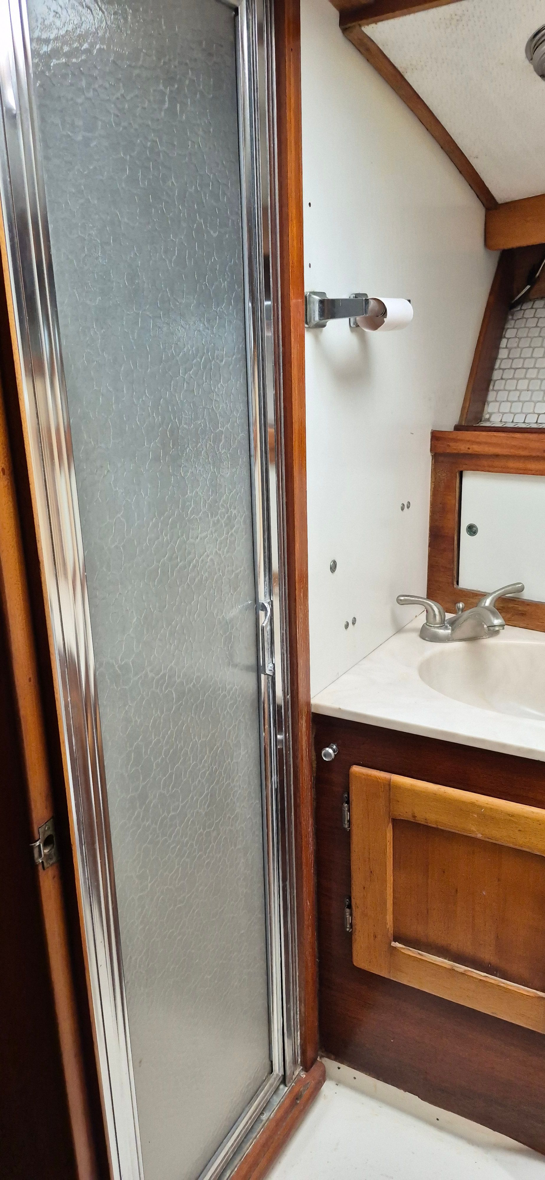 Interior of 1976 Egg Harbor 33 Sportfisher with shower and sink.