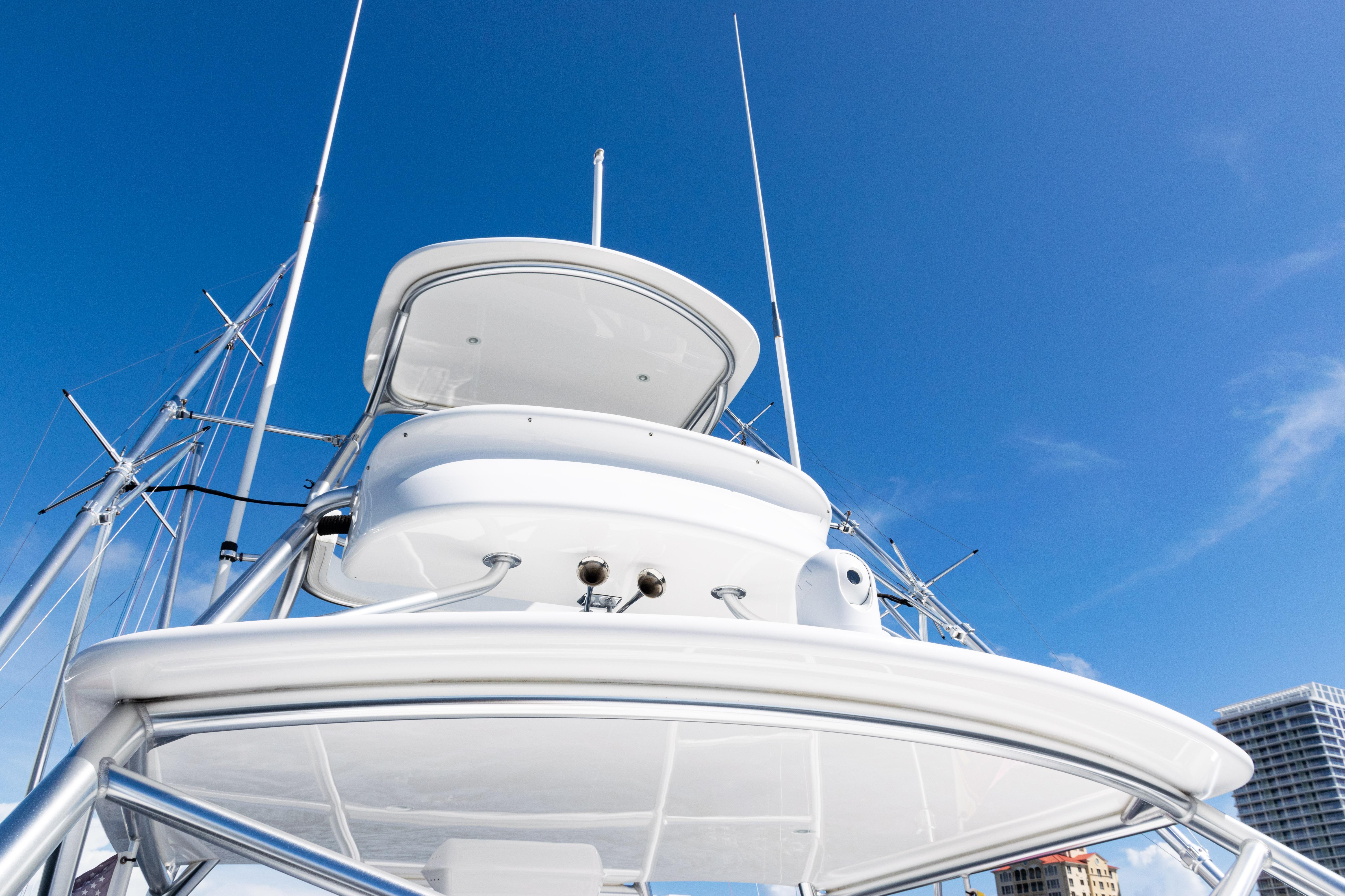 2021 Viking 44 Open yacht against clear blue sky, showcasing sleek design and structure.