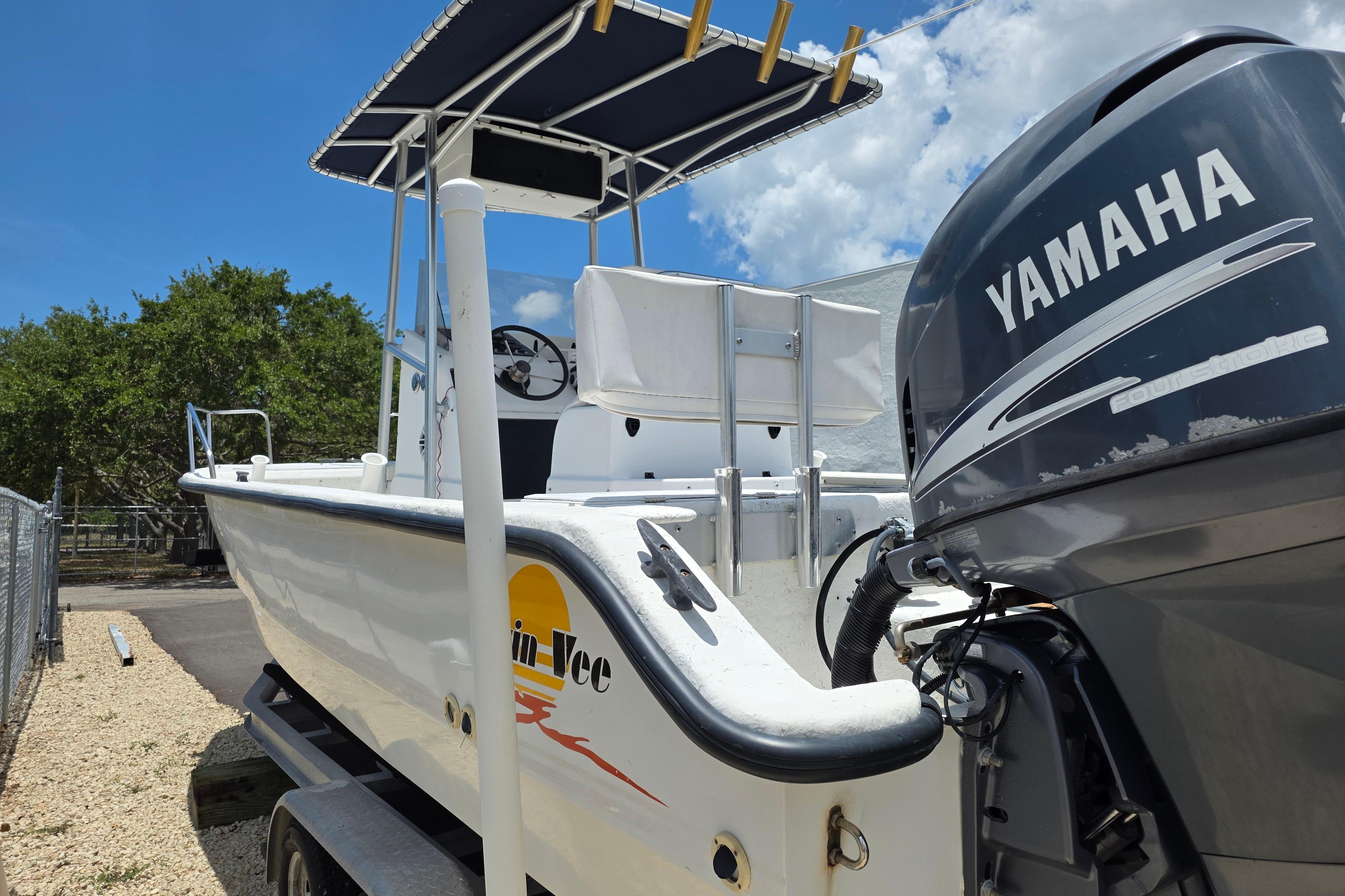 Twin Vee Awesome 22 boat from 1999 with Yamaha outboard motor, parked outdoors.
