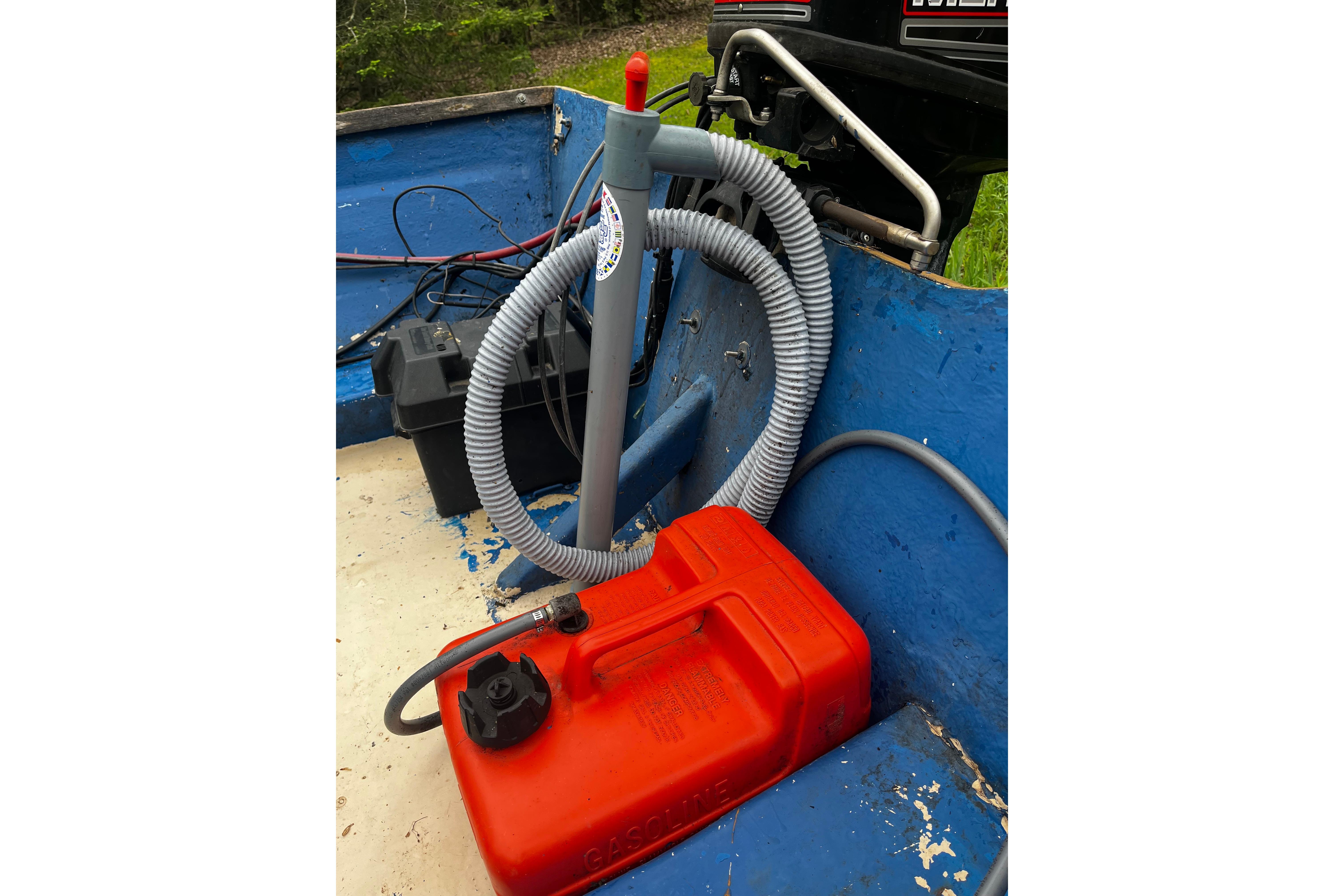 1968 Cape Dory John Dory Center Console with red fuel tank and hoses in blue interior.