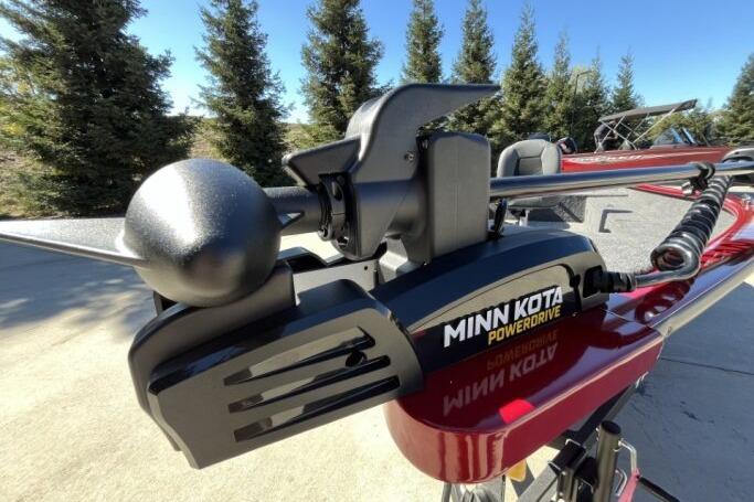 Minn Kota PowerDrive on 2025 Tracker Super Guide V-16 T boat, outdoors with trees in background.