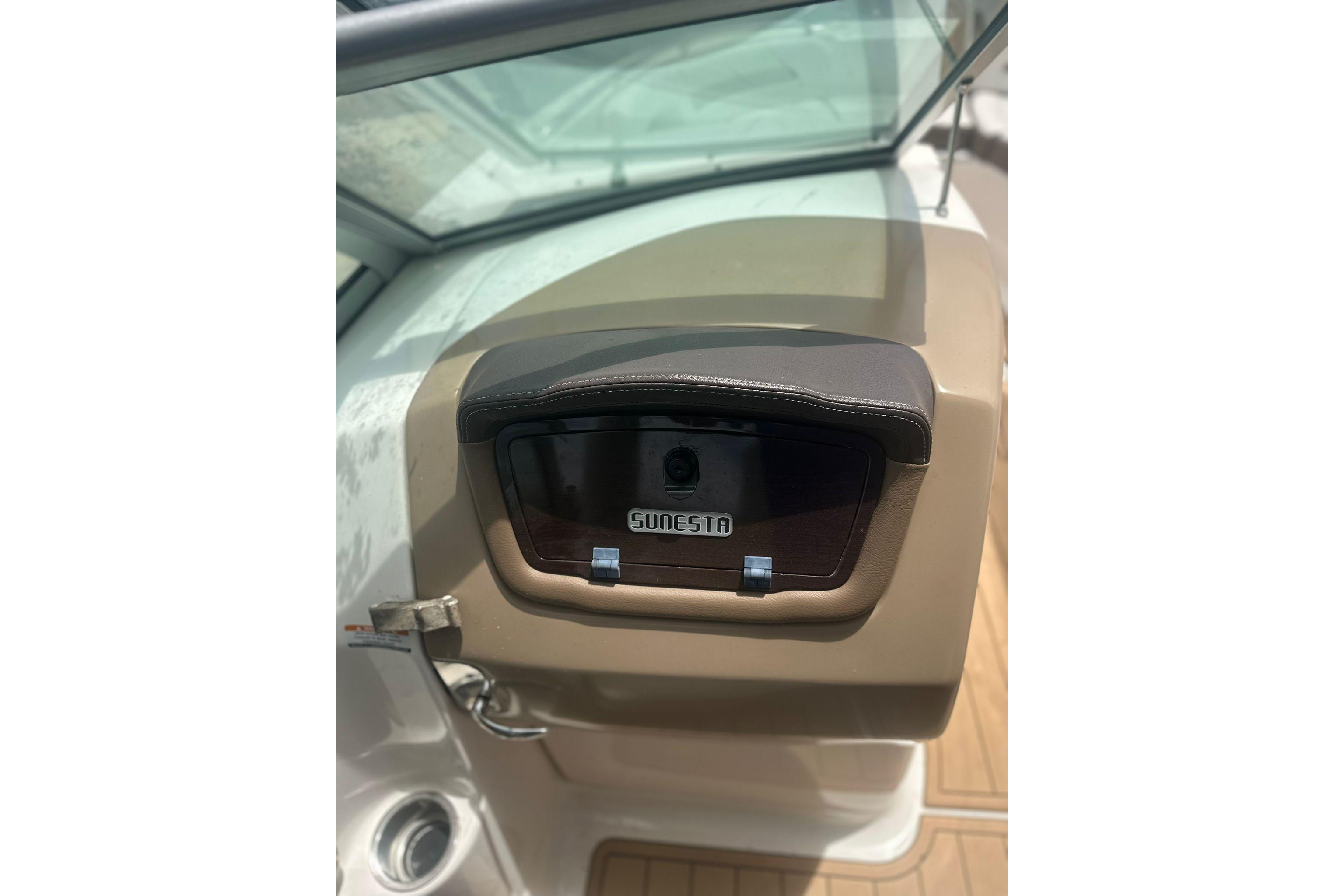 2015 Chaparral 264 Sunesta boat dashboard with Sunesta logo and windshield.