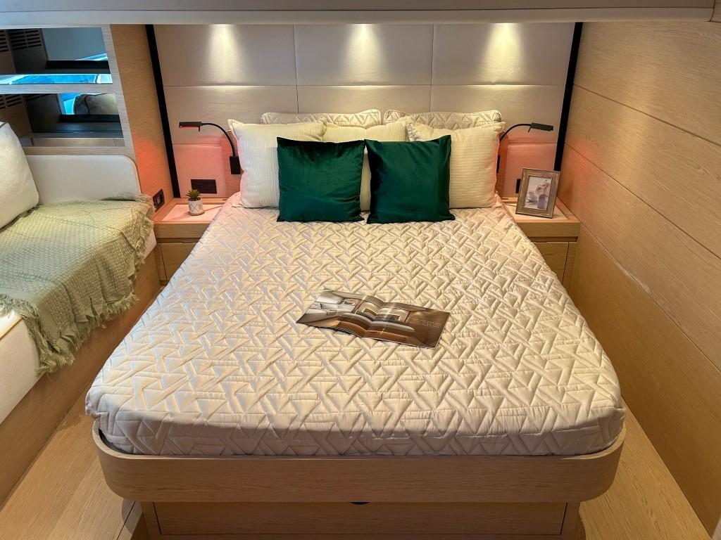 Luxurious bedroom interior of 2024 Solaris Power 52 Open yacht with modern decor.