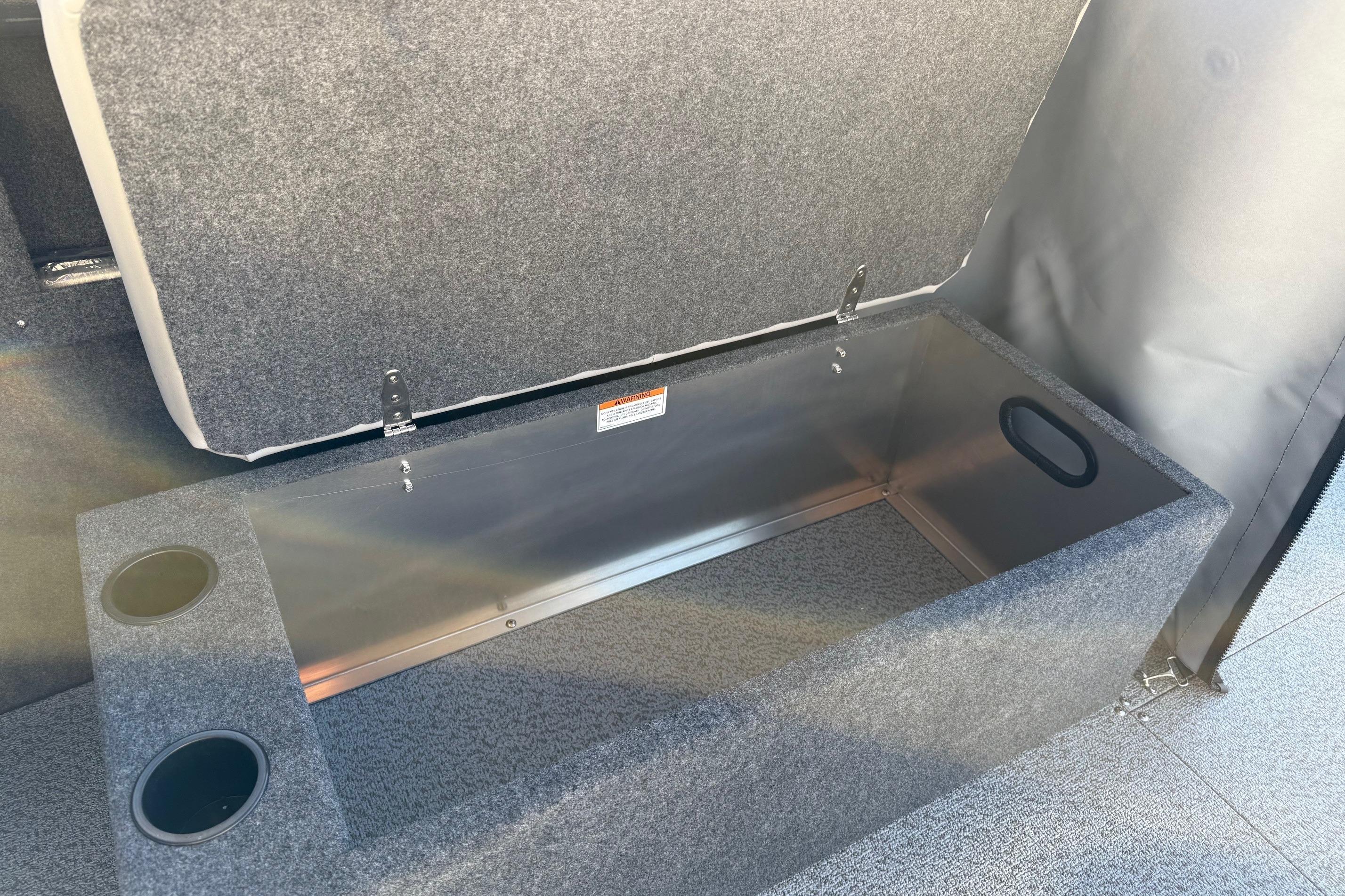 Open storage compartment in 2026 Thunder Jet 200 Luxor boat with cup holders.