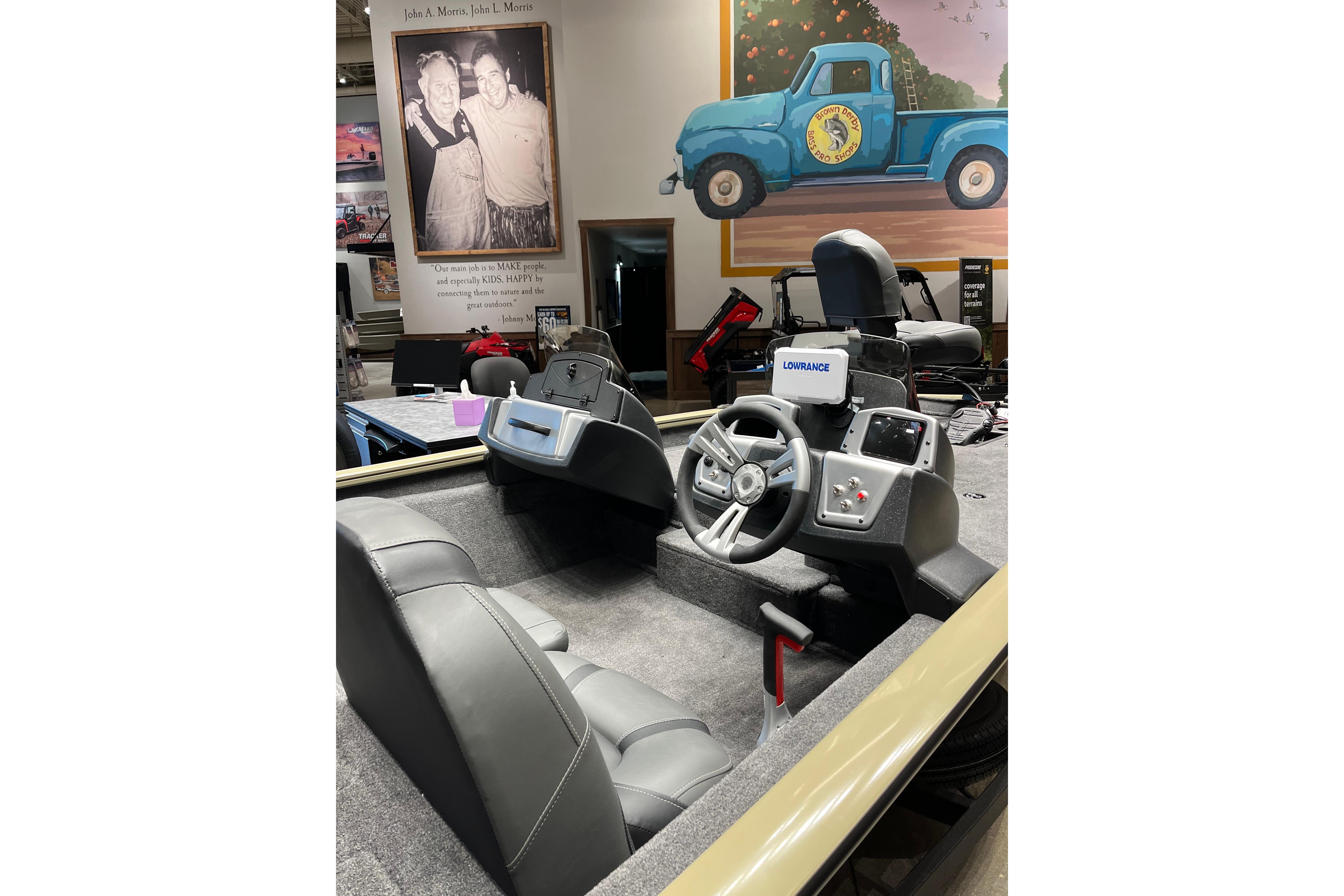 2026 Tracker Pro Team 175 boat interior with steering wheel and control panel.
