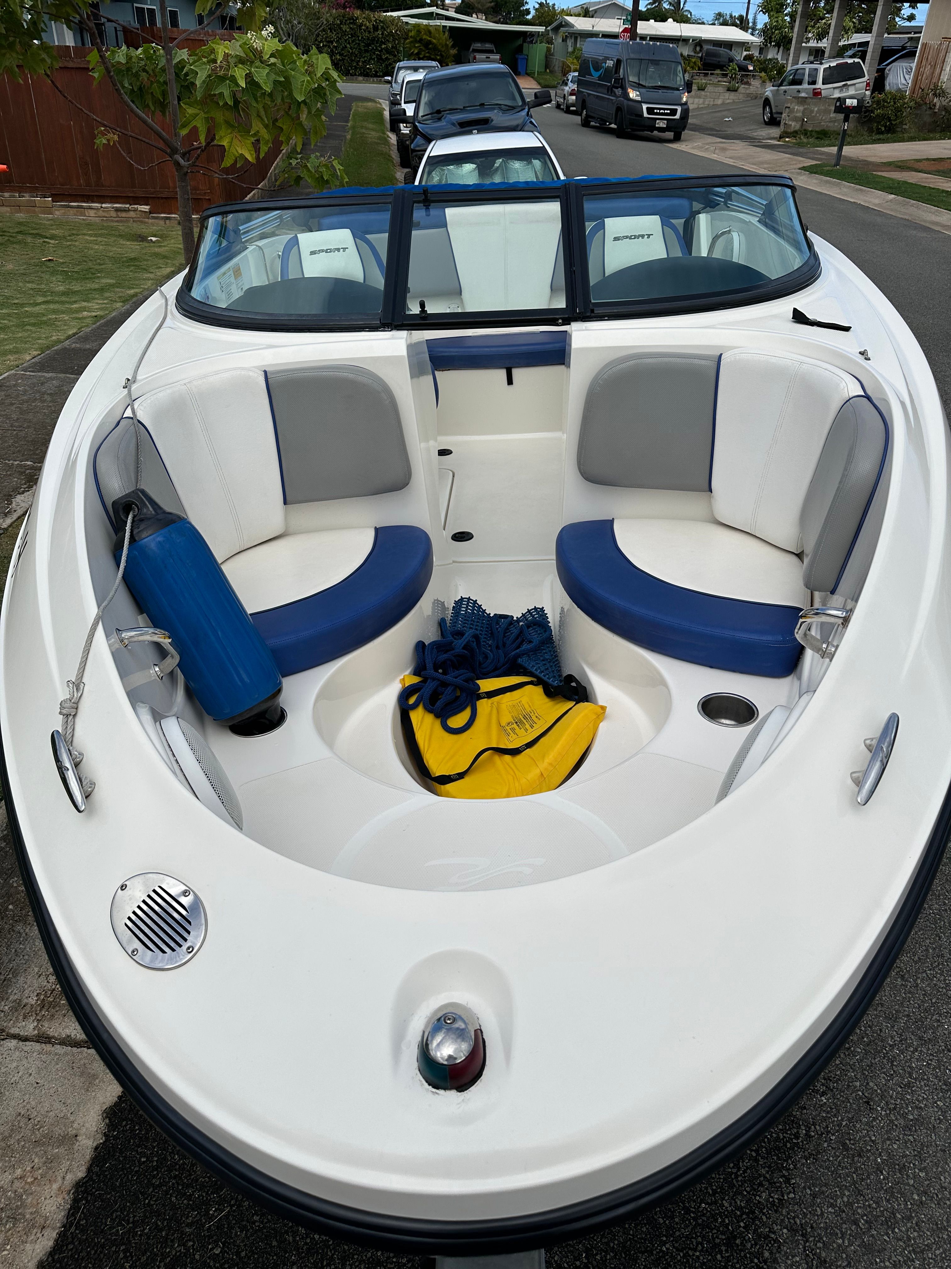 Interior view of a 2011 Sea Ray 185 Sport boat with blue and gray seating.