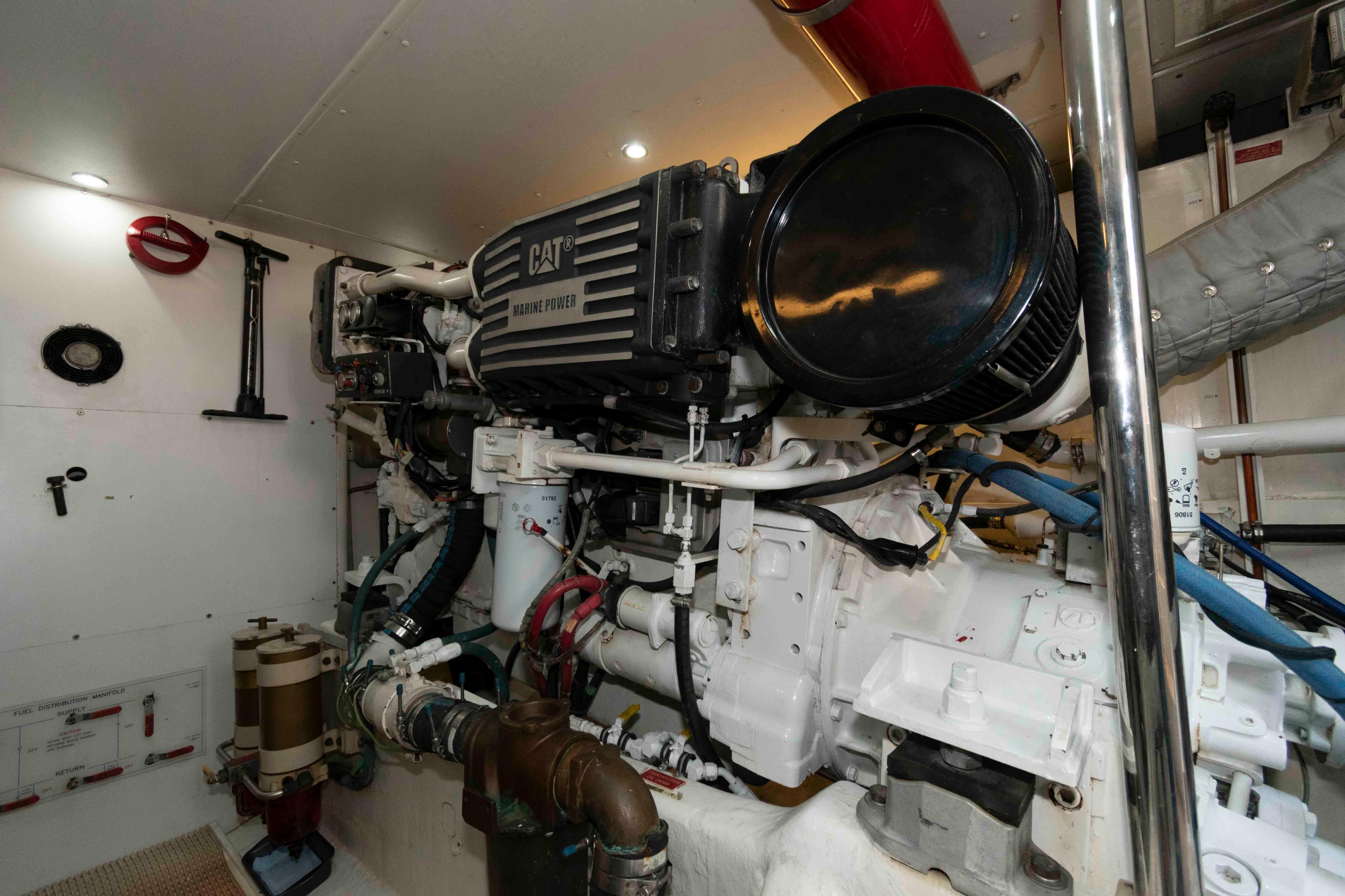 Engine room of 1999 West Bay 58 Sonship Pilothouse MY with CAT marine power engine.