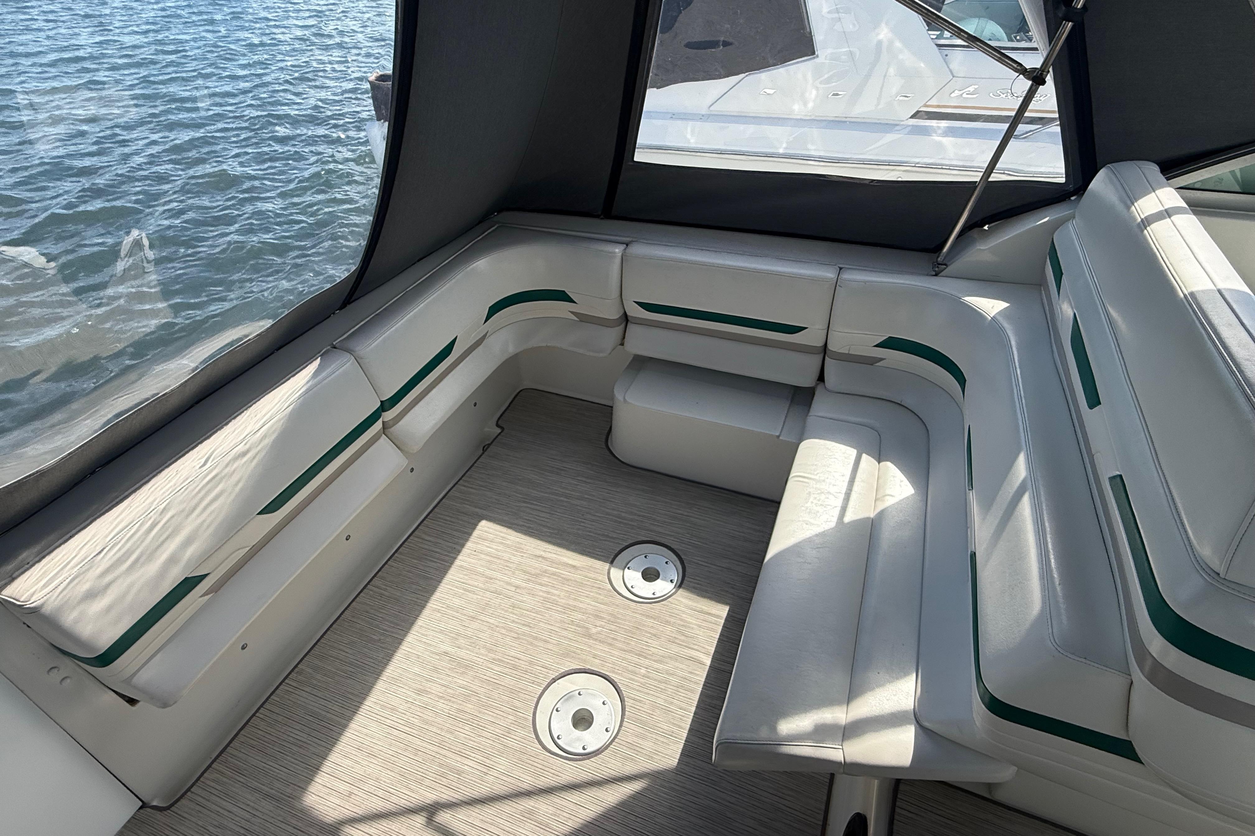 Interior seating of a 1999 Formula 34 Performance Cruiser with water view.