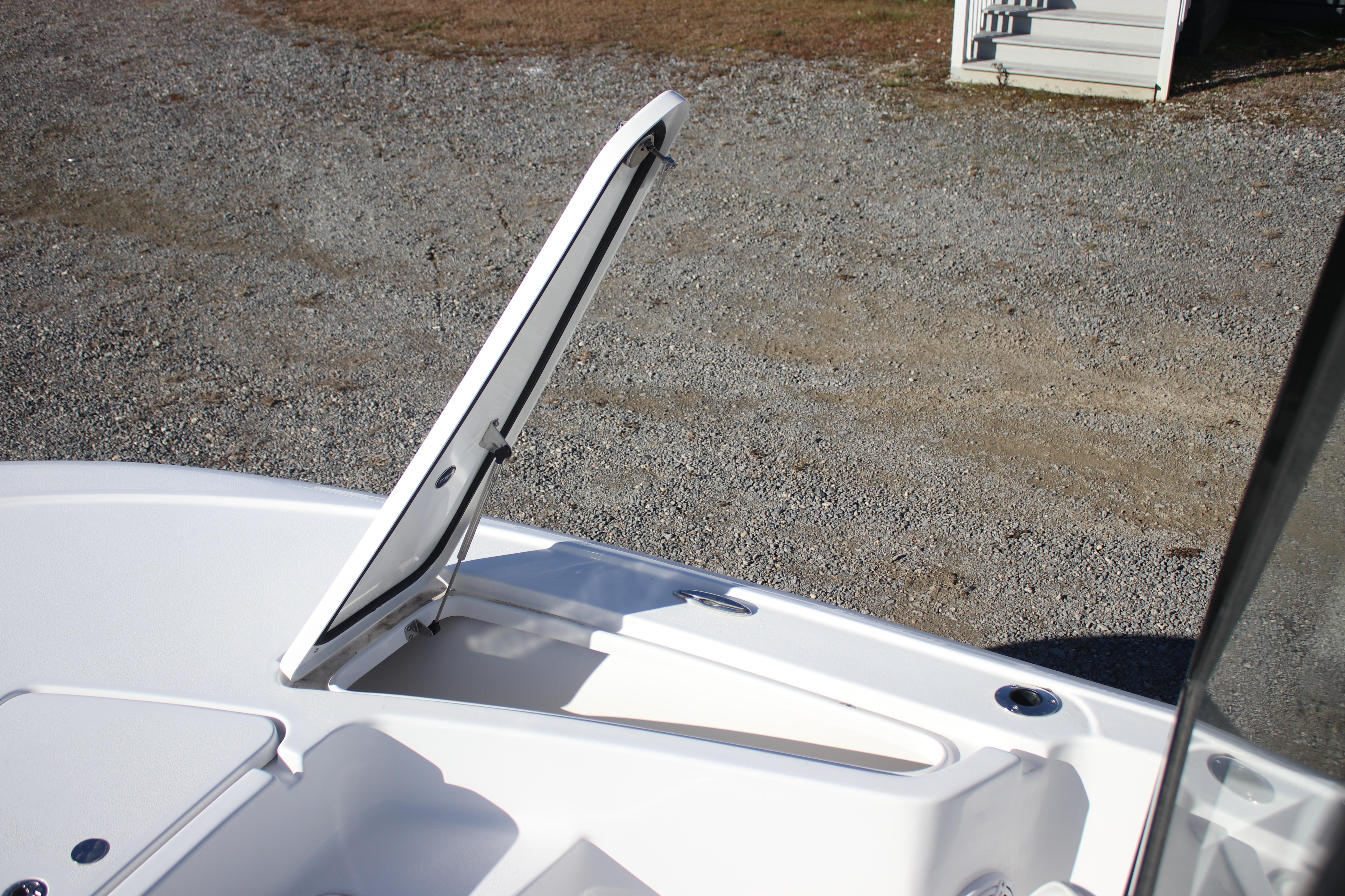 Open storage compartment on a 2026 Tidewater 2210 Carolina Bay boat.