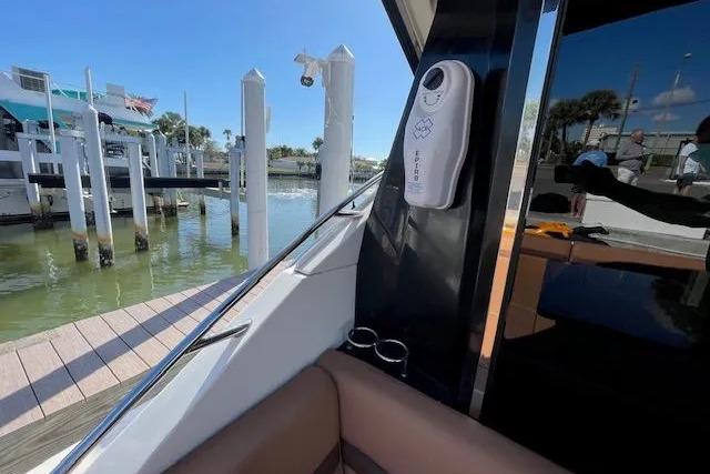 2016 Sea Ray Sundancer 510 docked, showcasing luxurious interior and marina view.