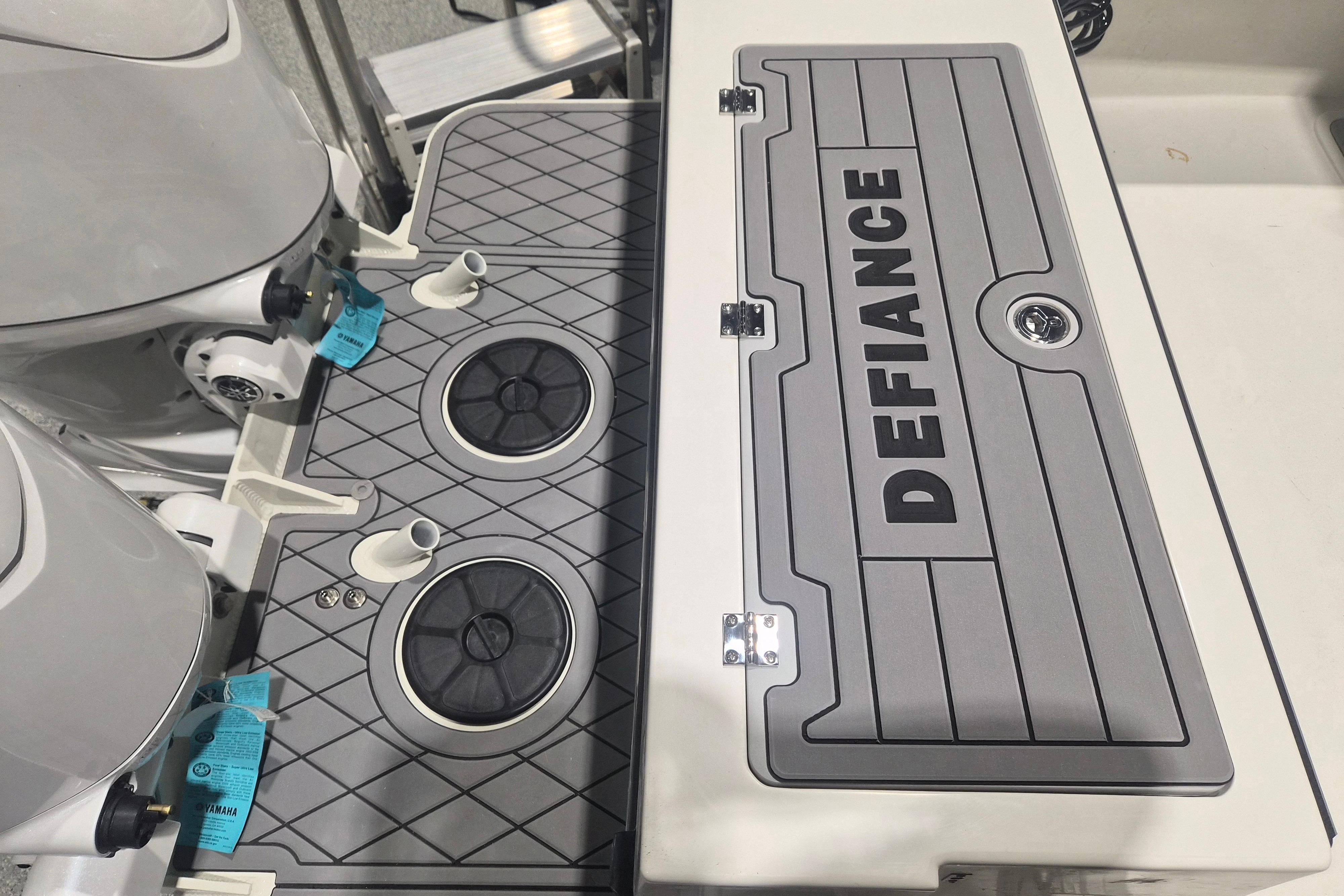 2026 Defiance Admiral 260 EX boat deck with dual engines and storage compartment.