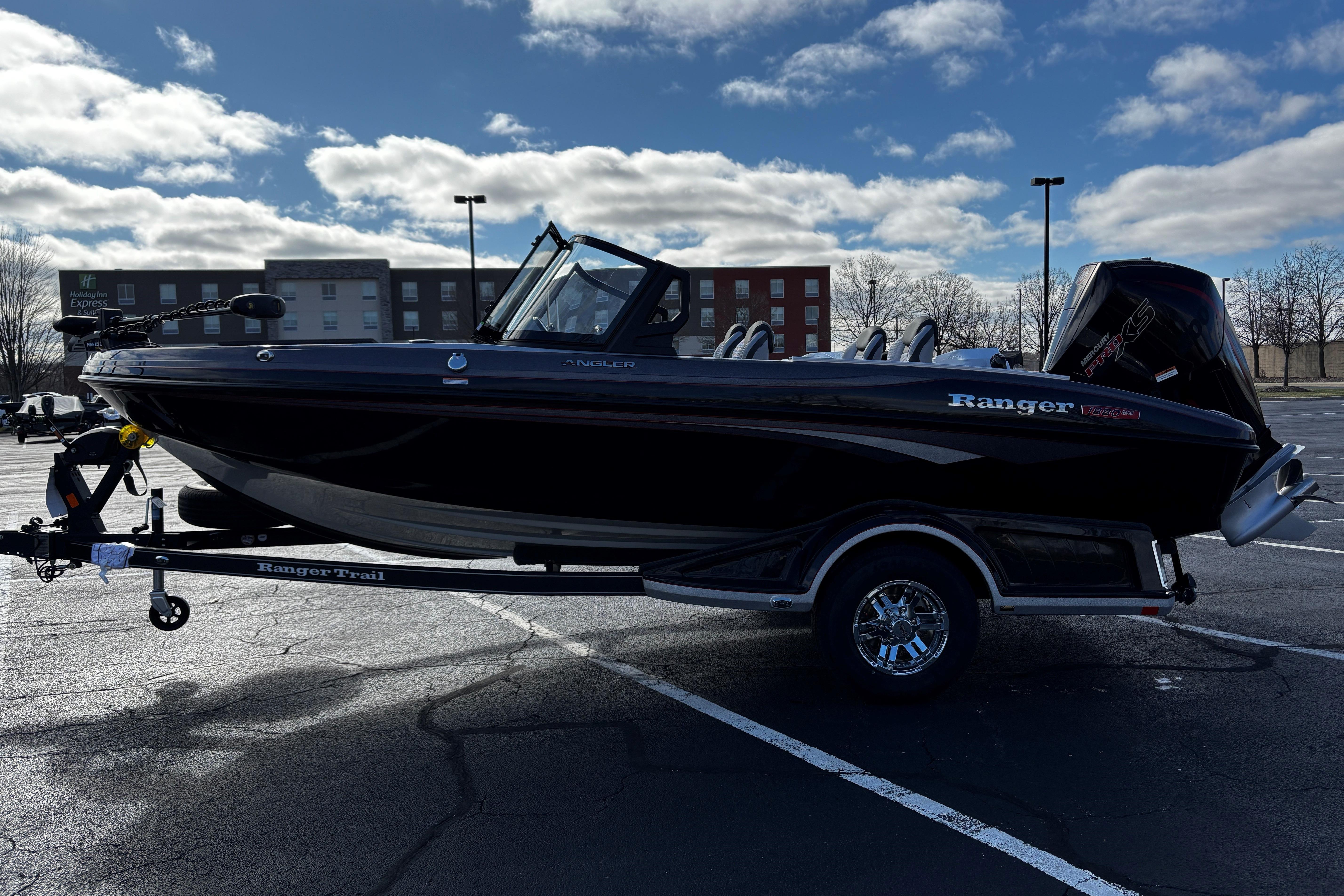 2026 Ranger 1880MS boat on trailer in parking lot under cloudy sky.