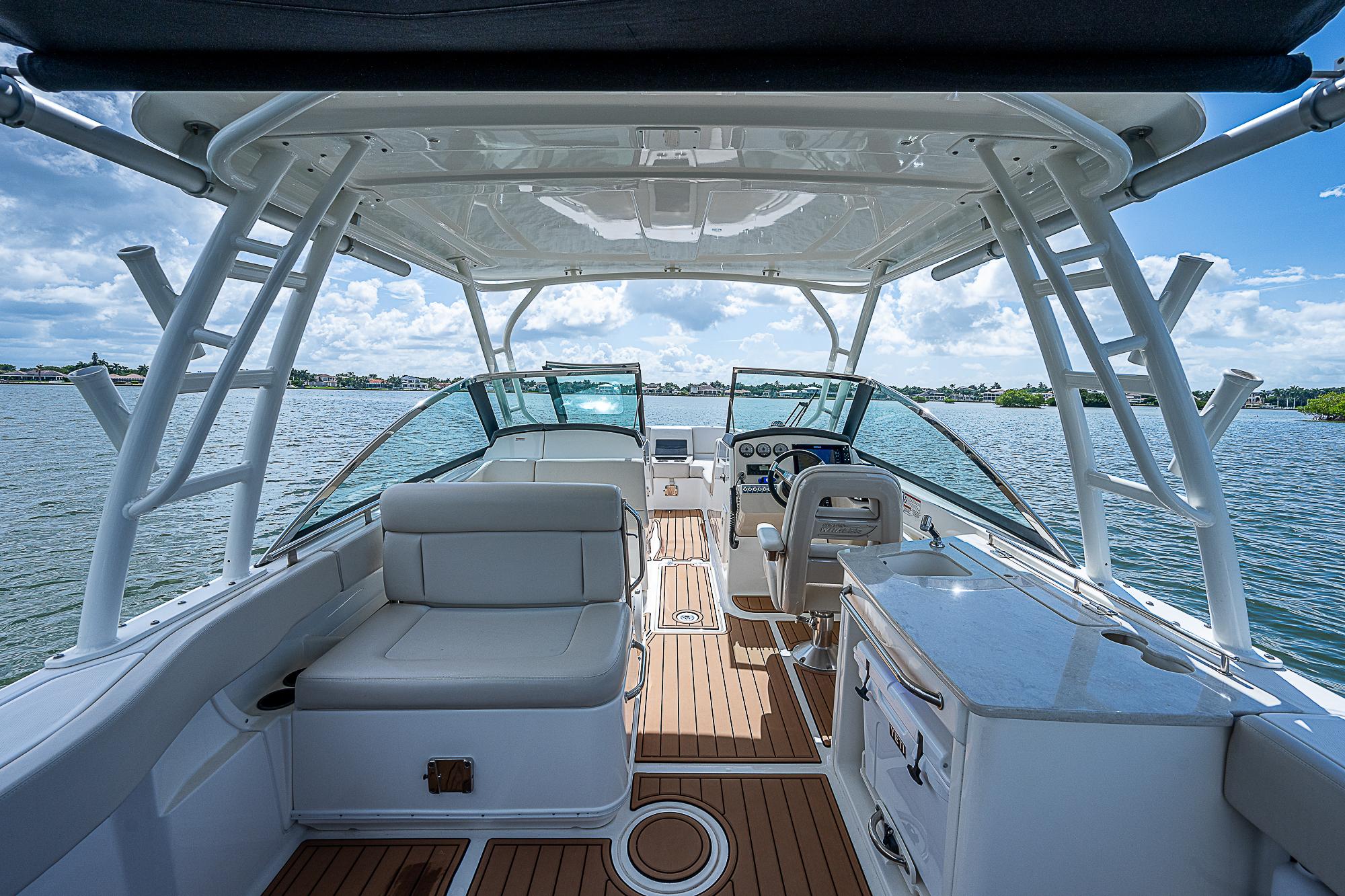 2018 Boston Whaler 270 Vantage boat interior with seating and helm, on open water.