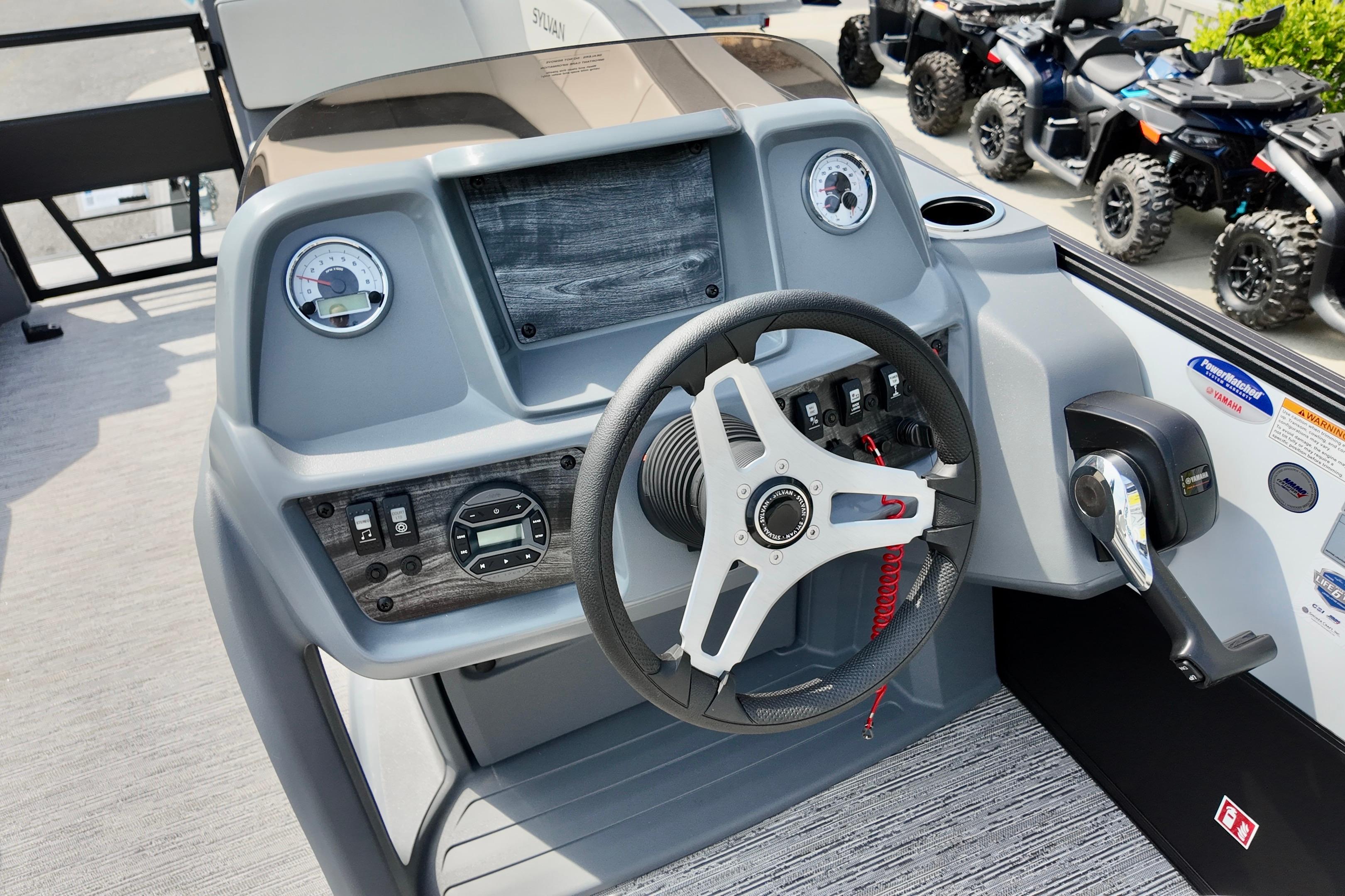 2026 Sylvan A-20 LZ DH boat dashboard with steering wheel and control panel.