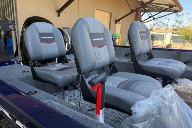 2026 Tracker Pro Guide V-16 SC boat interior with three gray seats.