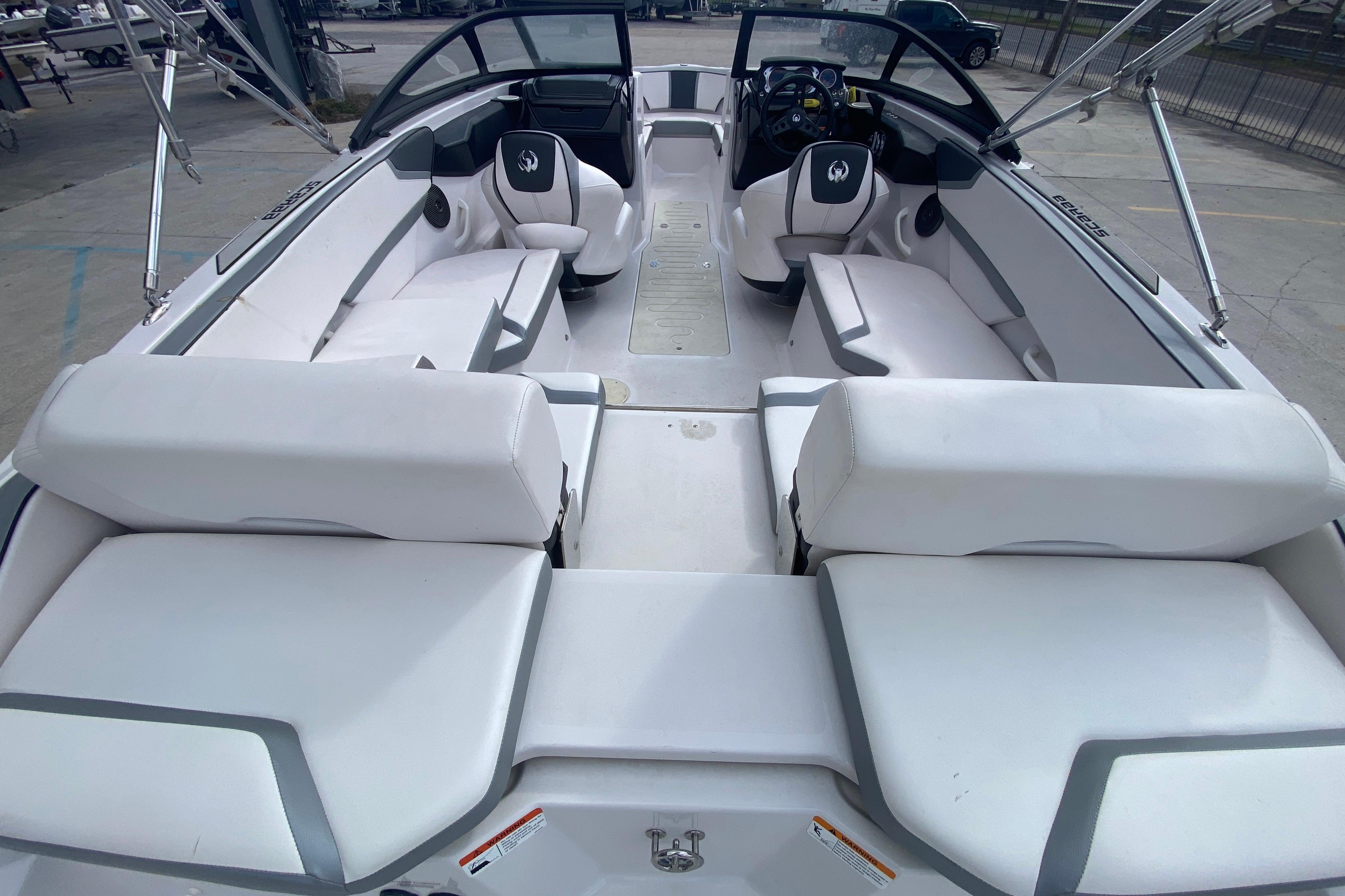 2018 Scarab 215 G boat interior with white seating and modern design.