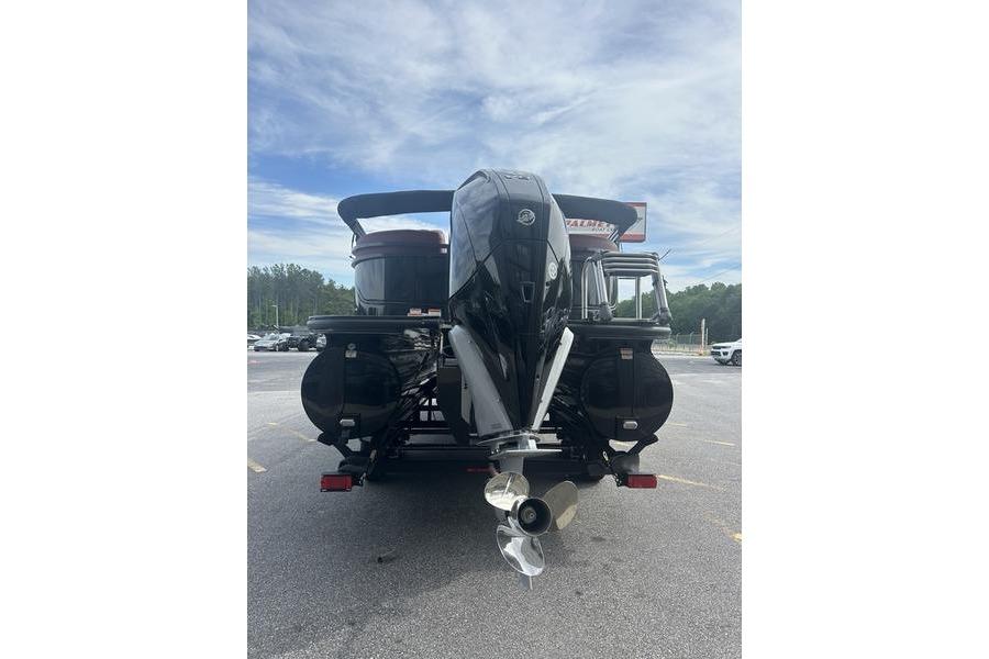Rear view of 2026 Regency 230 DL boat with powerful outboard motor.