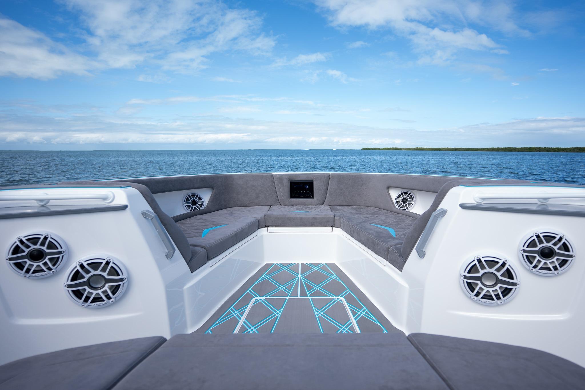 Luxury interior of 2025 Deep Impact 499 Sport boat on open water.