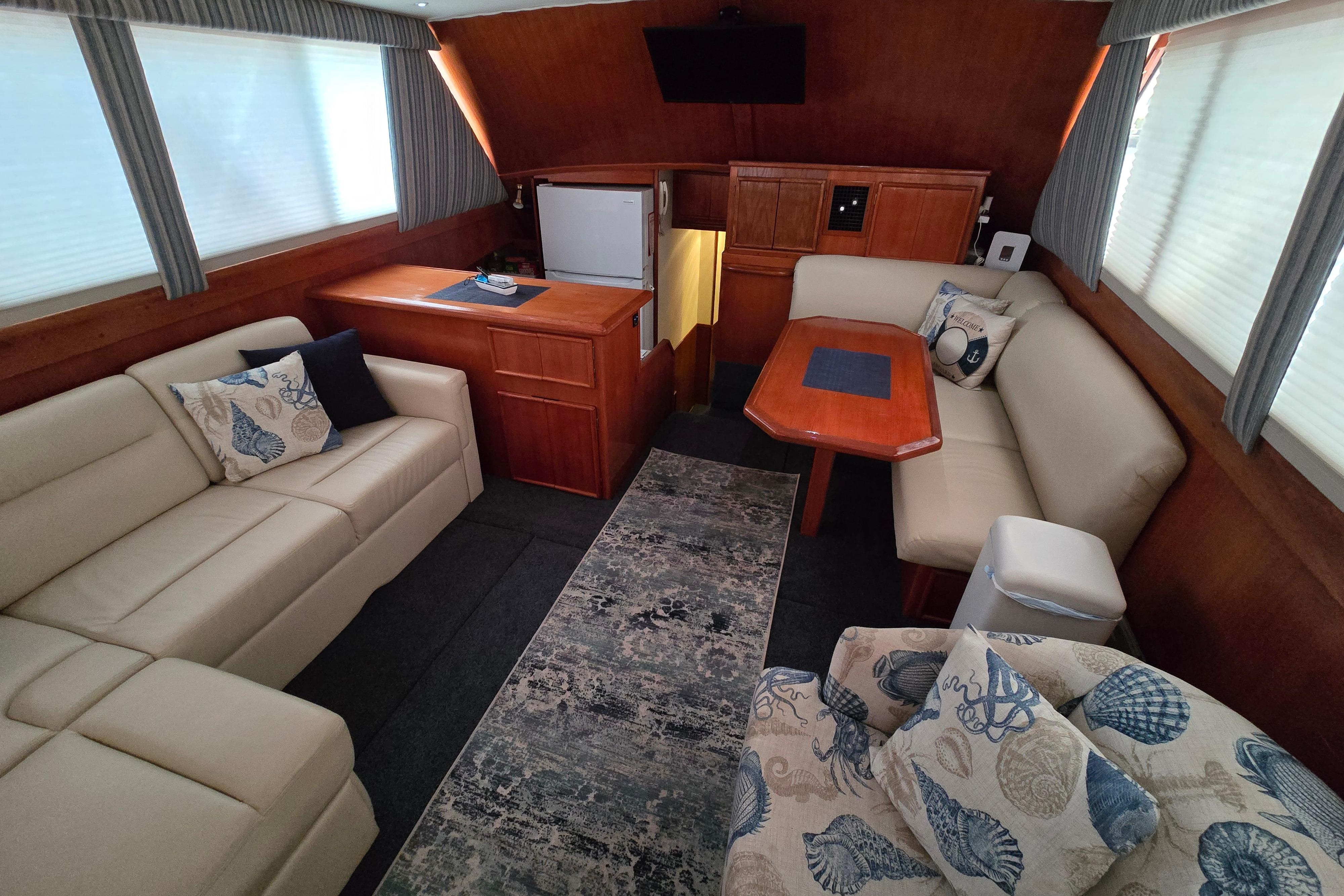 Luxurious interior of a 1988 Post 46 Convertible yacht with elegant seating and decor.