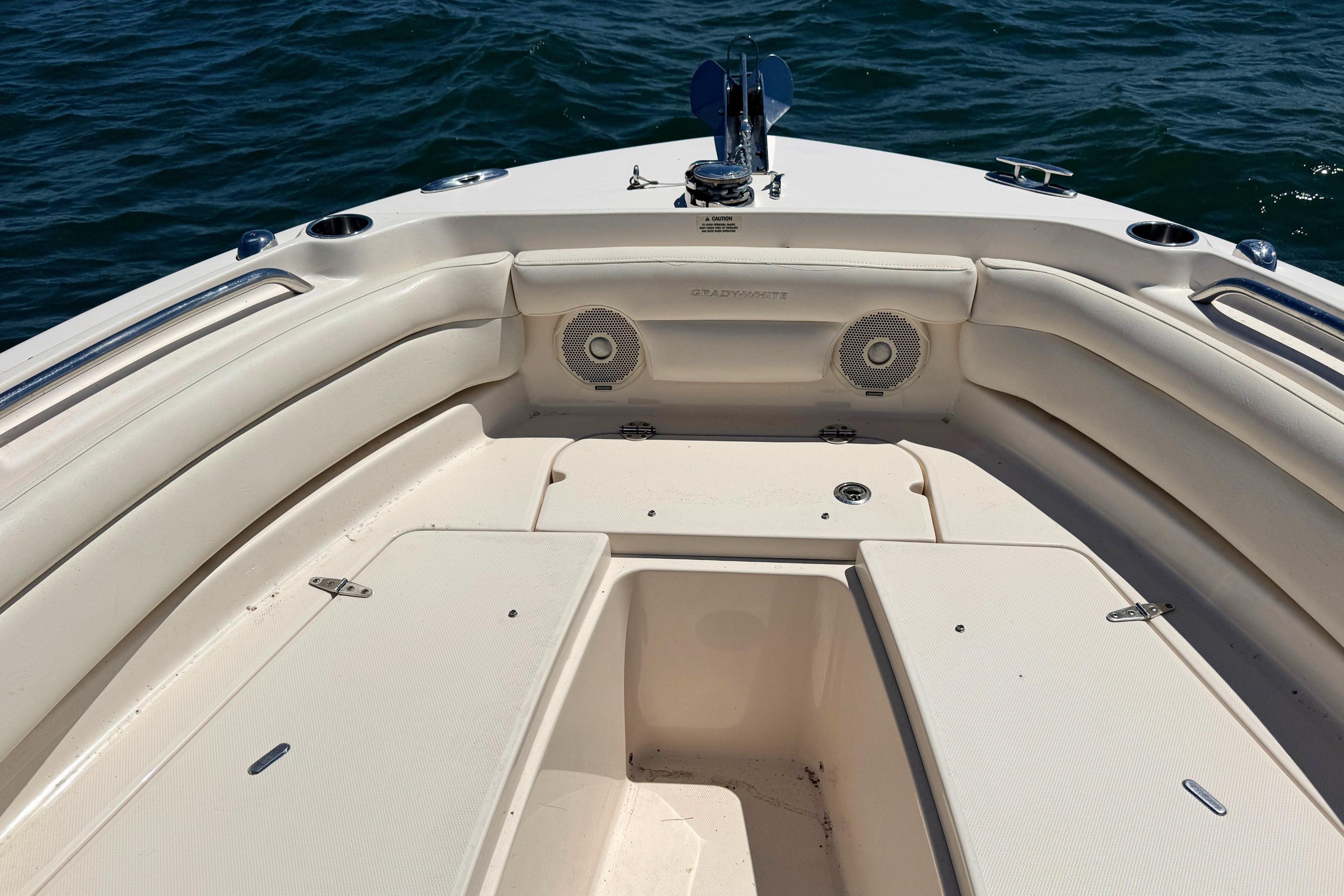 2017 Grady-White Freedom 235 boat interior with seating and speakers on open water.