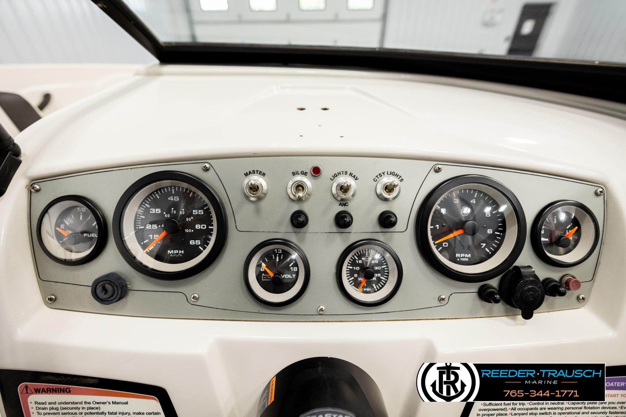 Dashboard of a 2016 Tahoe 450 TS boat with gauges and controls.